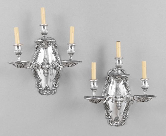 Pair of "Vintage" Silverplate Wall Sconces: Pair of American "Vintage" Pattern Silverplate Three-Light Wall Sconces, first quarter 20th century, the oval backplates, scrolled arms and drip pans decorated with grapes and grape leaves, set with e