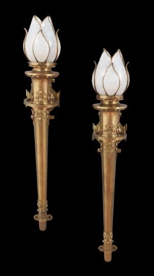 Pair of American Arts and Crafts Brass Sconces: Pair of American Arts and Crafts Brass Torchere-Form Sconces, first quarter 20th century, the hammered bodies decorated with applied cartouches, the backplates within cartouche-form bezels, set with t
