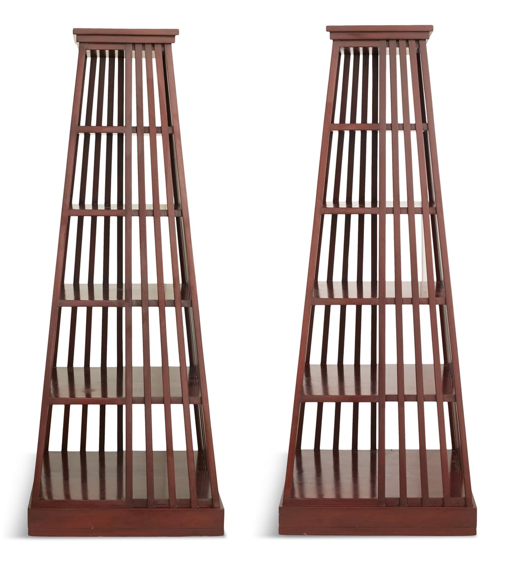 Pair of Nancy Corzine Pyramidal-Form Etageres: Pair of Mahogany Pyramidal-Form Etageres20th century, by Nancy Corzine, unmarked, each tapered and fitted with five graduated shelves, the sides with vertical slats and raised on a platform base.h. 73