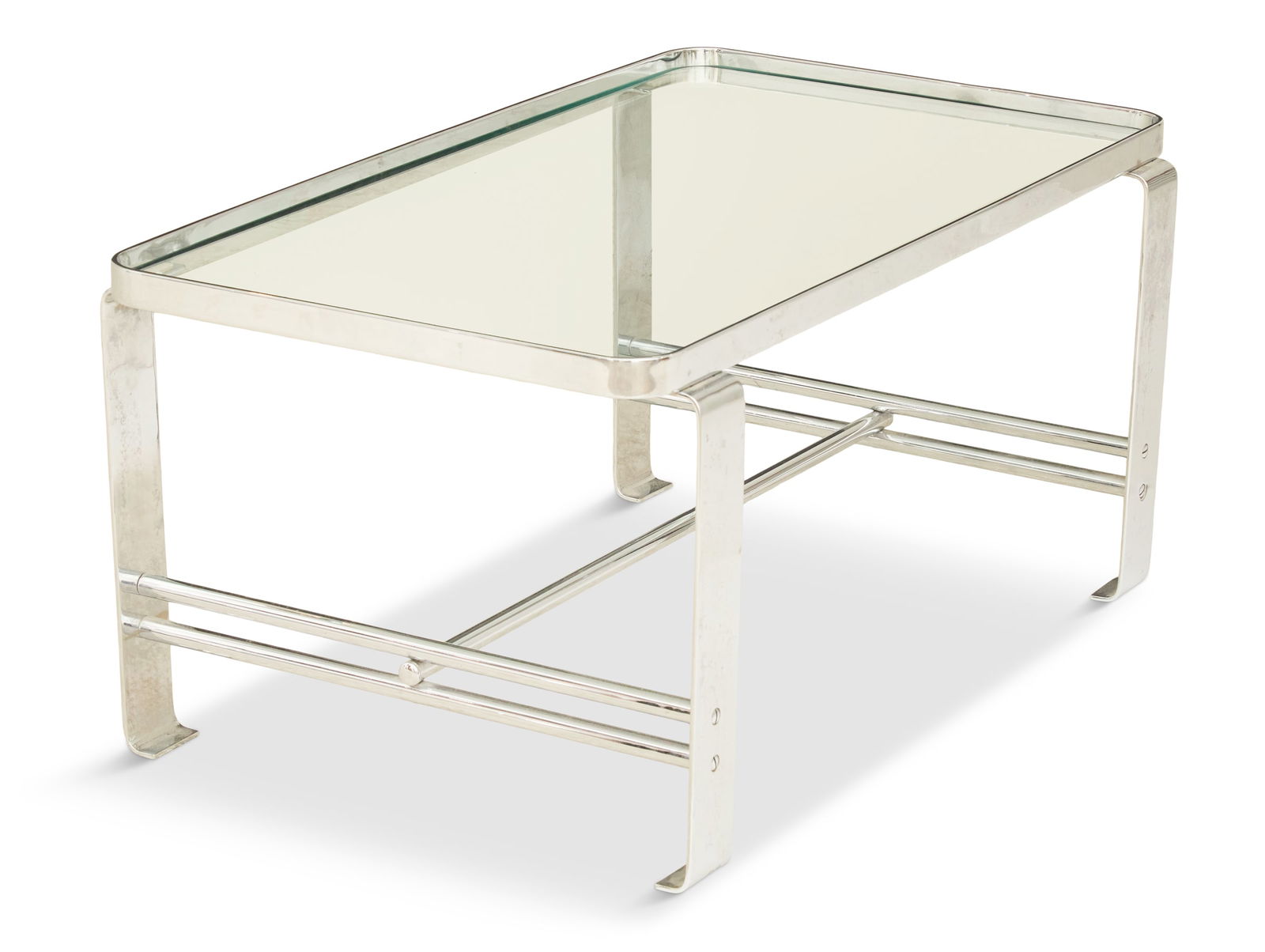 Wolfgang Hoffmann Chrome and Glass Coffee Table: Wolfgang Hoffmann Chrome and Glass Coffee Tableca. 1930, produced by Howell, the rounded glass top on an H-stretcher, with rounded legs.h. 17", w. 36", d. 22"