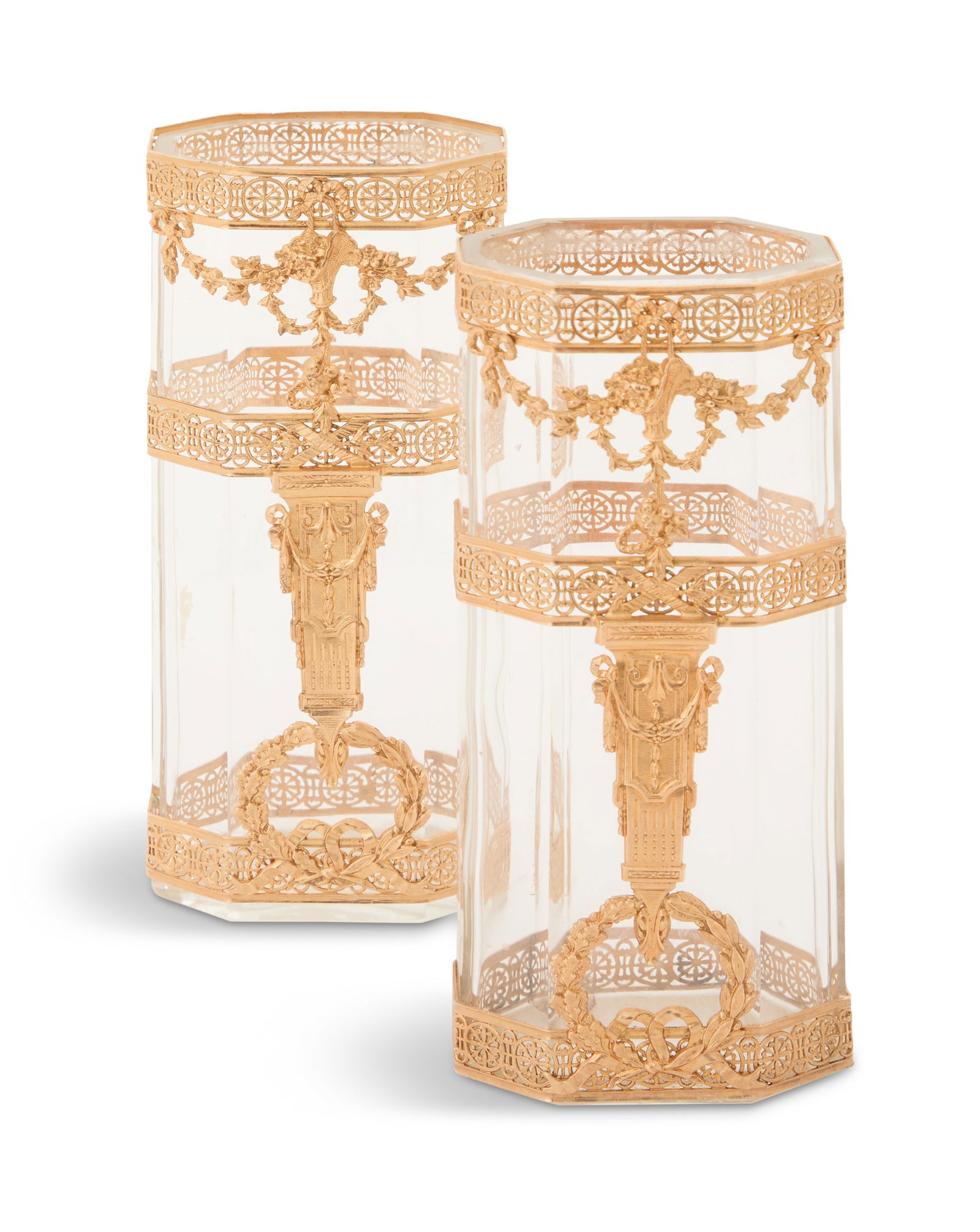 Pair of French Gilt-Brass-Mounted Cut-Glass Vases: Pair of French Gilt-Brass-Mounted Cut-Glass Vasesearly 20th century, the oval faceted crystal vases decorated with delicate pierced brass mounts with pierced medallions, trophies, swags and wreaths.h.