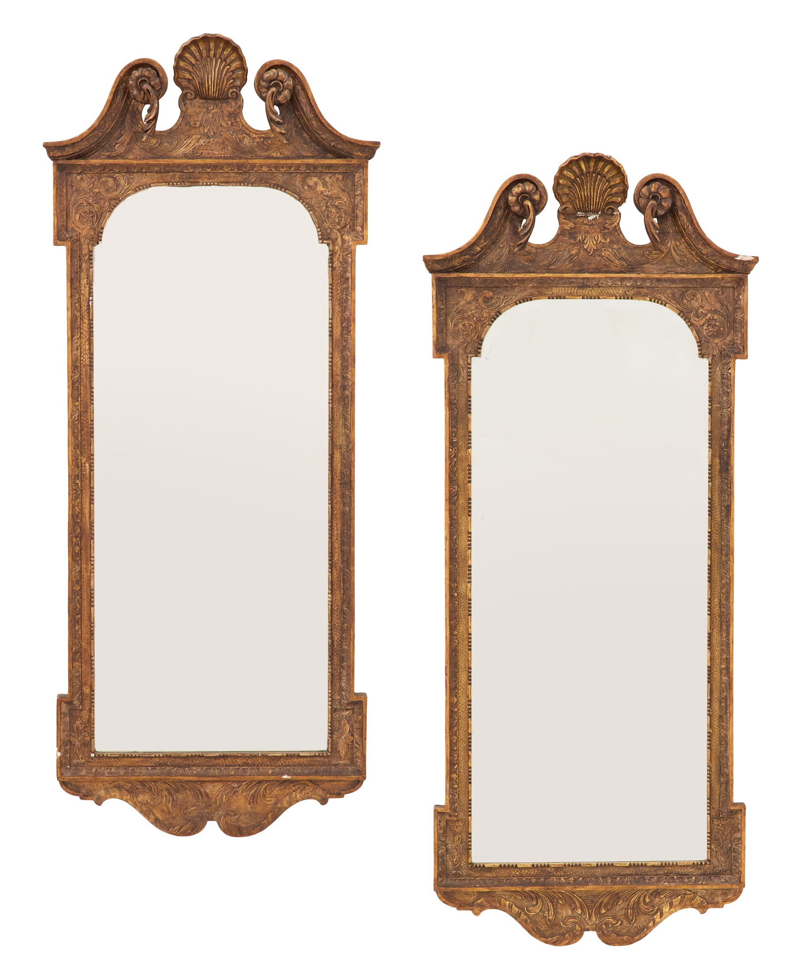 Pair of Edwardian Giltwood Mirrors: Pair of Edwardian Giltwood Mirrorsearly 20th century, in the Georgian taste, the swan's-neck pediment set with shell finials, the surround with crossetted corners, the lower "Cupid's bow" skirt carved