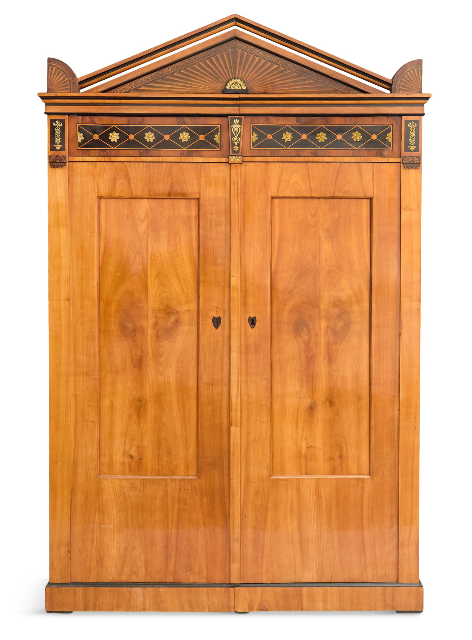 Rare Biedermeier Bronze-Mounted Fruitwood Armoire: Rare Biedermeier Bronze-Mounted Fruitwood Armoire early 19th century, the top with a neoclassical-form inlaid pediment and corner ornaments, over a pair of framed and paneled doors. h. 84", w. 54", d.