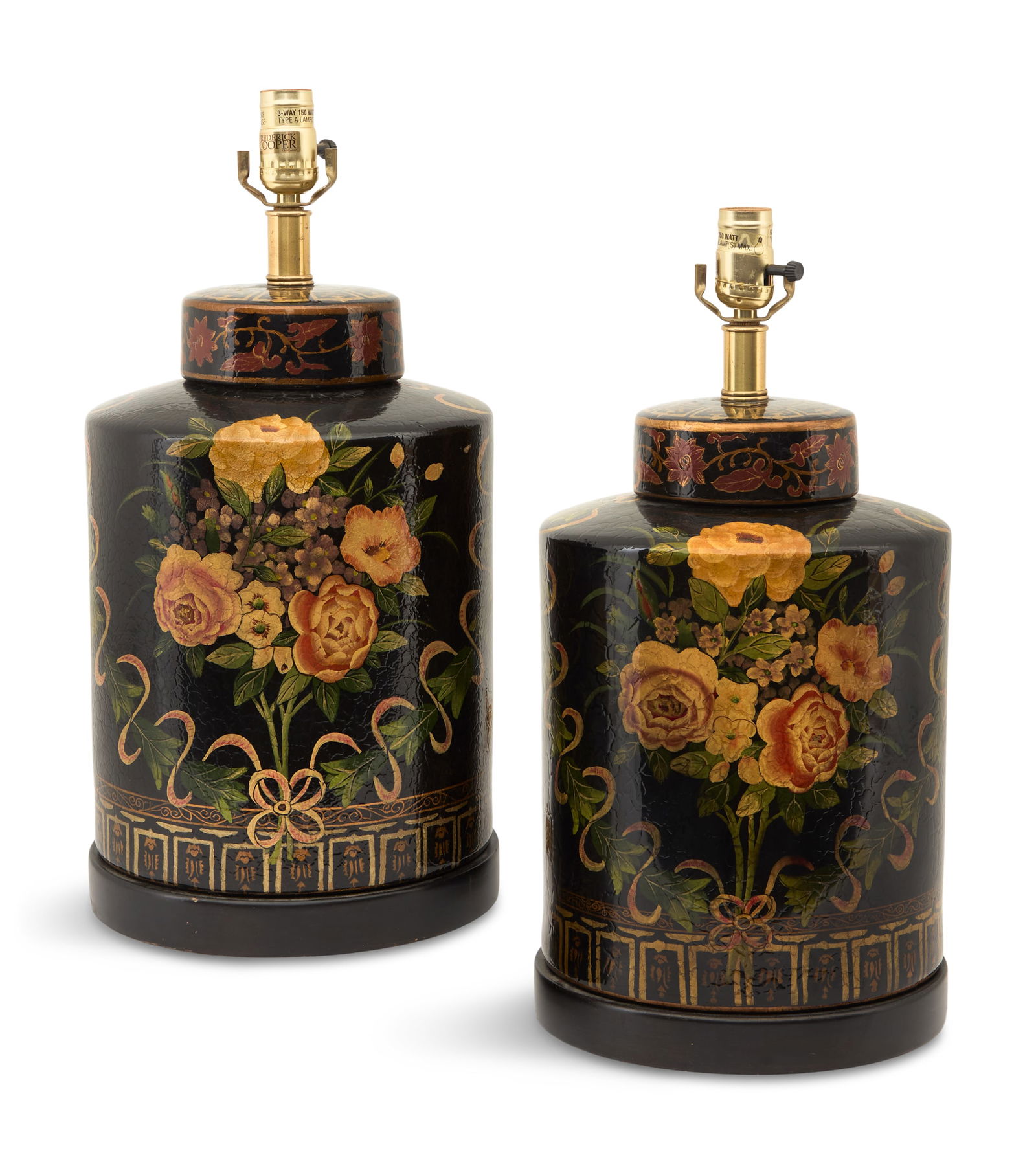 Pair of Frederick Cooper Pottery Lamps: Pair of Frederick Cooper Pottery Lamps20th century, in the form of tea canisters, decorated with bouquets of roses and violets framed with ivy intertwined with ribbons, on wooden bases.h. 19", dia. 8"