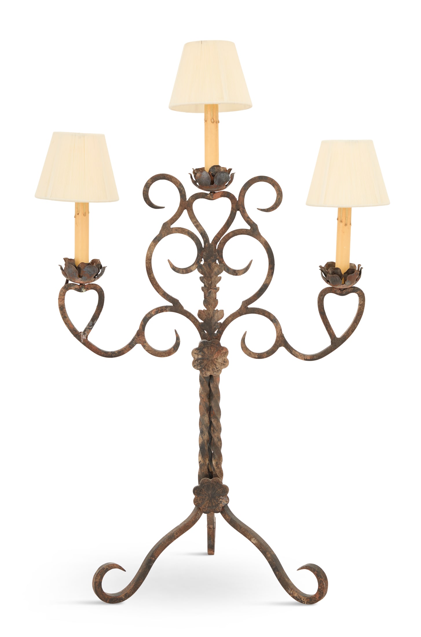 Baronial Candelabrum Lamp: Baronial Candelabrum Lampwith three floriform-molded candle sockets supported on scrolled arms, emanating from a rope-twist standard, on a tripod base with scrolled feet, fitted with lampshades.h. 33"