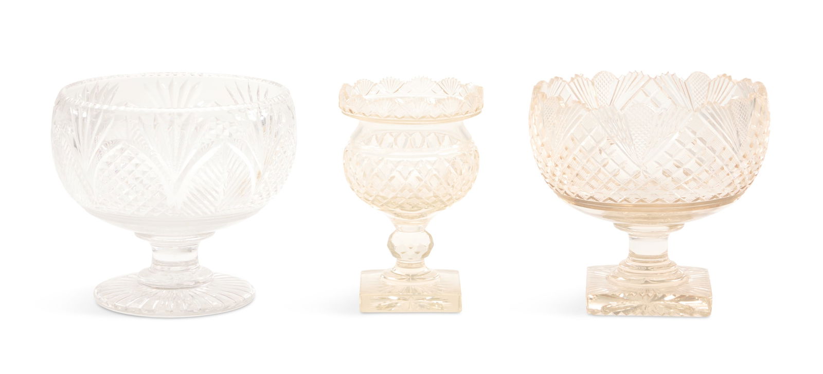 Three Pieces of Edwardian Anglo-Irish Cut Glass: Three Pieces of Edwardian Anglo-Irish Cut Glass early 20th century, the collection including a strawberry- and fan-cut compote, h. 7-1/2", dia. 7-3/4", a compote cut with pointed leaves, h. 7-1/4",