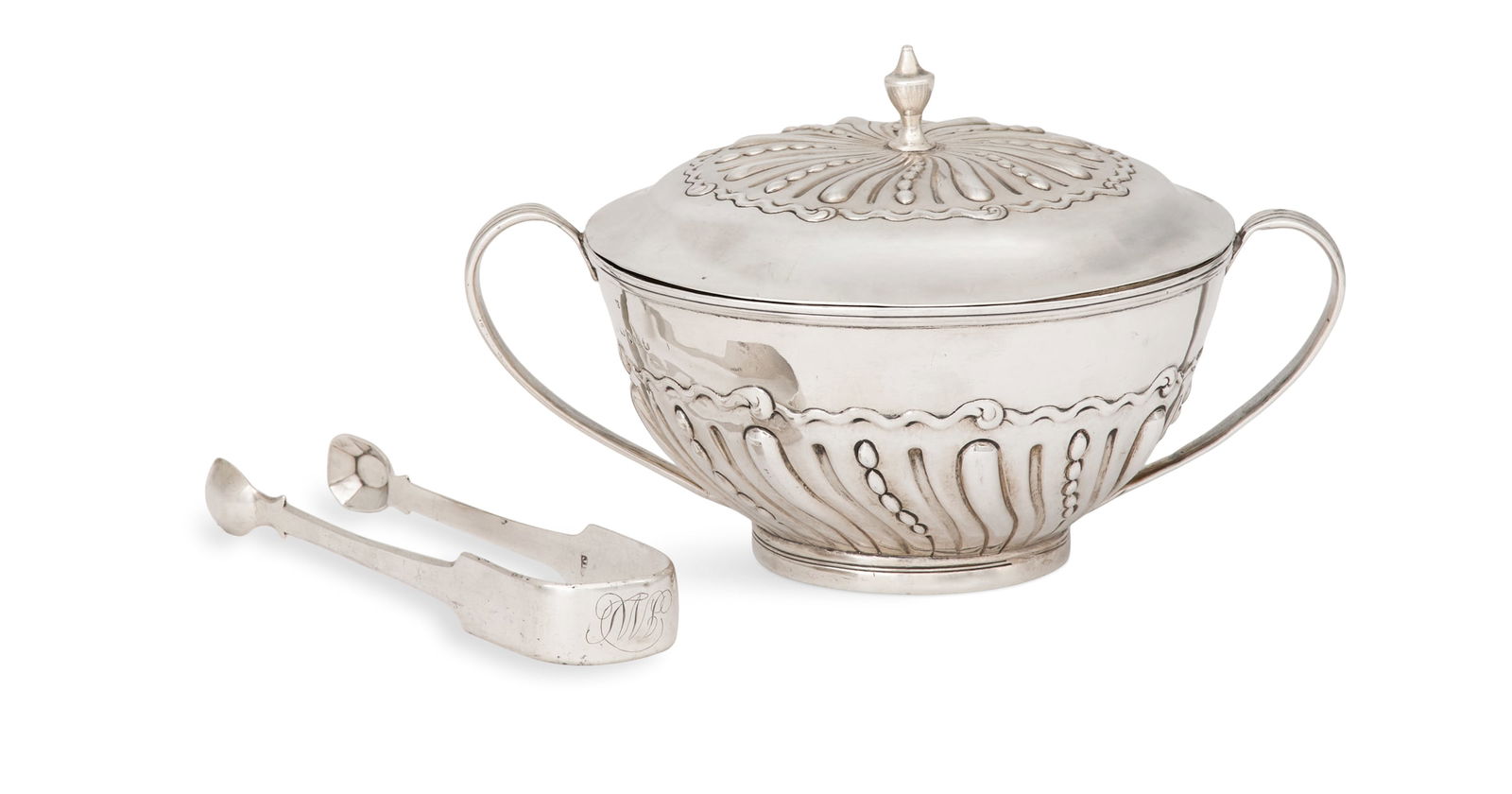 Late Georgian Silver Sugar Bowl and Tongs: Late Georgian Sterling Silver Sugar Bowl and Tongs both London, including: a covered sugar bowl, 1805-1806, the maker's mark rubbed, decorated with spiral gadrooning and reeded strap handles,