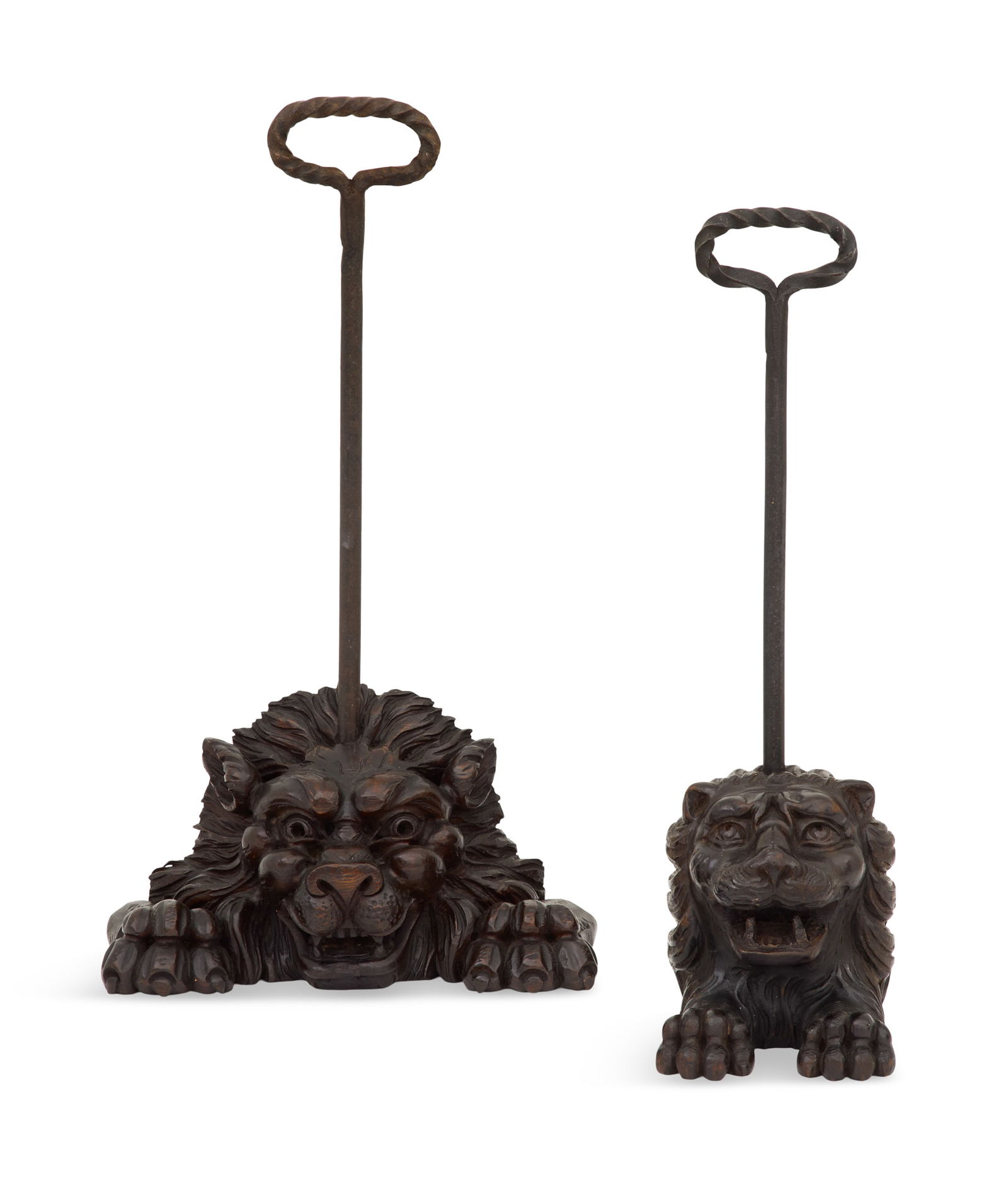 Pair of Carved Oak and Iron Figural Doorstops: Pair of Carved Oak and Iron Figural Doorstops19th century and later, the 19th-century carved oak lions now mounted as doorstops with handles.h. 19", w. 5", d. 5" and h. 20-1/4", w. 11", d. 6-1/2"