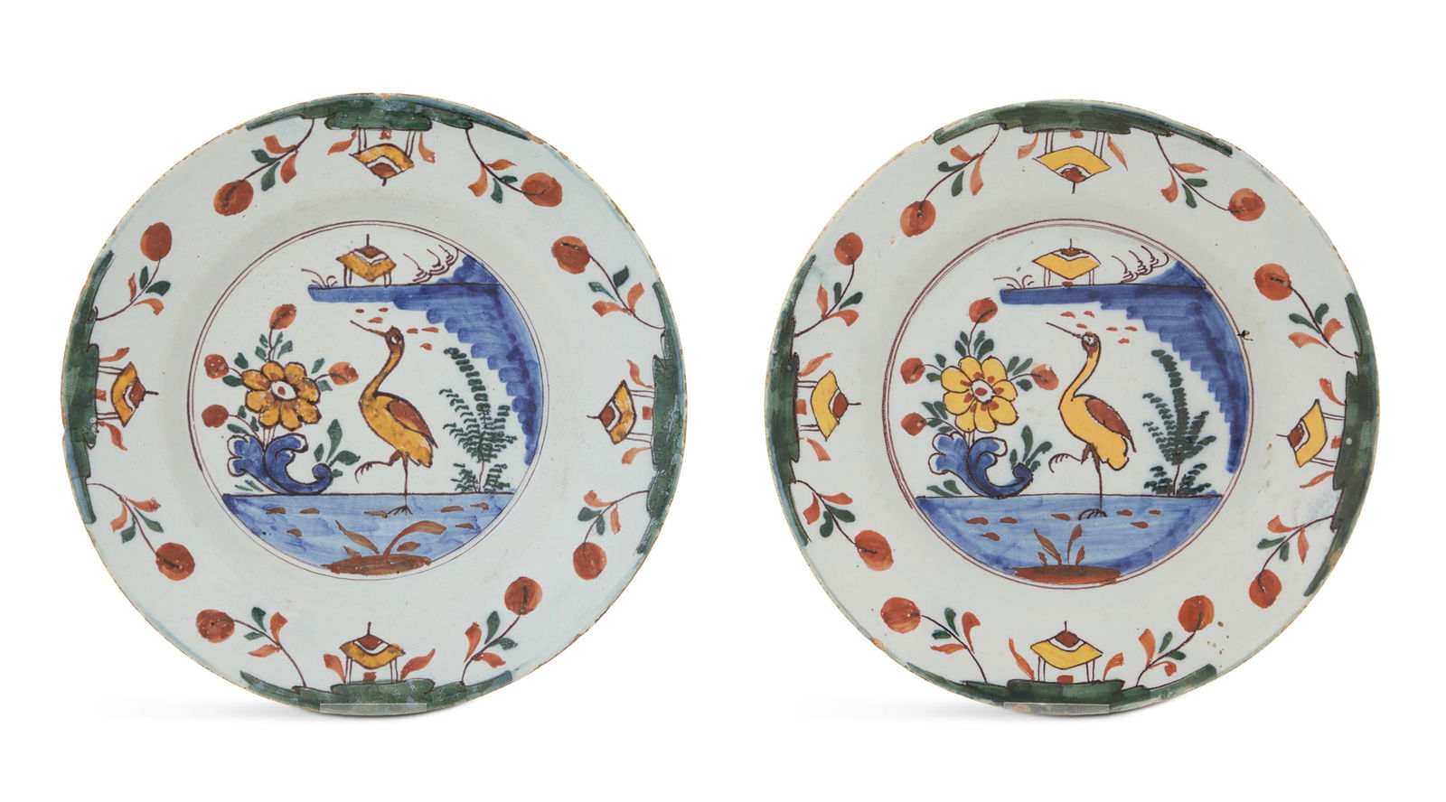 Pair of Delft Pottery Plates: Pair of Delft Pottery Plates 18th century, possibly Lambeth, London, England, decorated with a yellow crane standing in the water, the border with pagodas and sprigs of flowers. dia. 8-3/4"