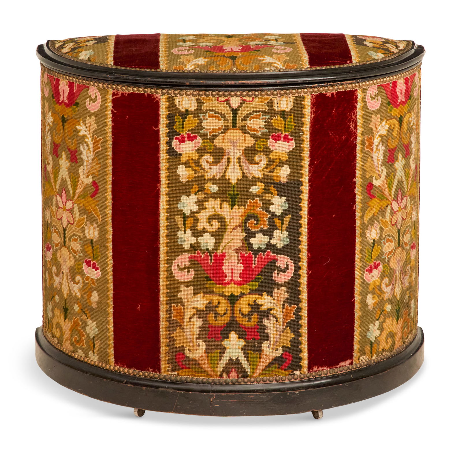 English Ebonized Wood and Fabric Hamper: English Ebonized Wood and Fabric Hamperca. 1900, the hemispherical hamper with a hinged cover, composed of an ebonized frame upholstered with panels of pink and green scrollwork tapestry, alternating