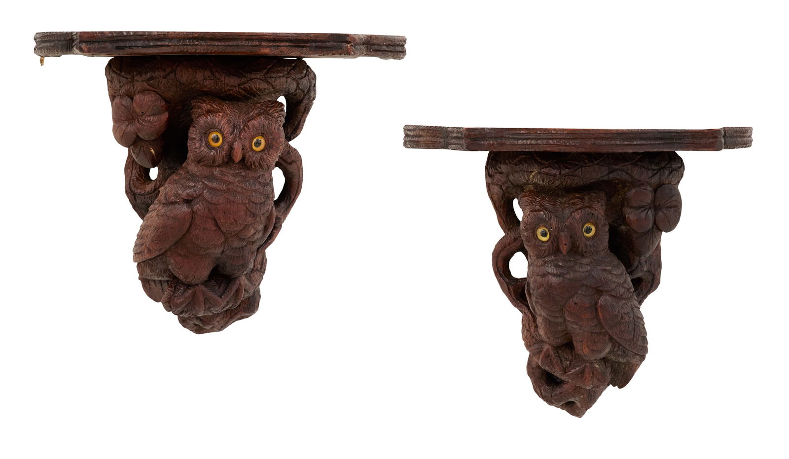 Pair of Black Forest Carved Wooden Wall Brackets: Pair of Black Forest Carved Wooden Wall Bracketslate 19th century, the brackets set with serpentine shelves, over glass-eyed owls perched in gnarled carved tree branches.h. 7", w. 8-1/2", d. 5"