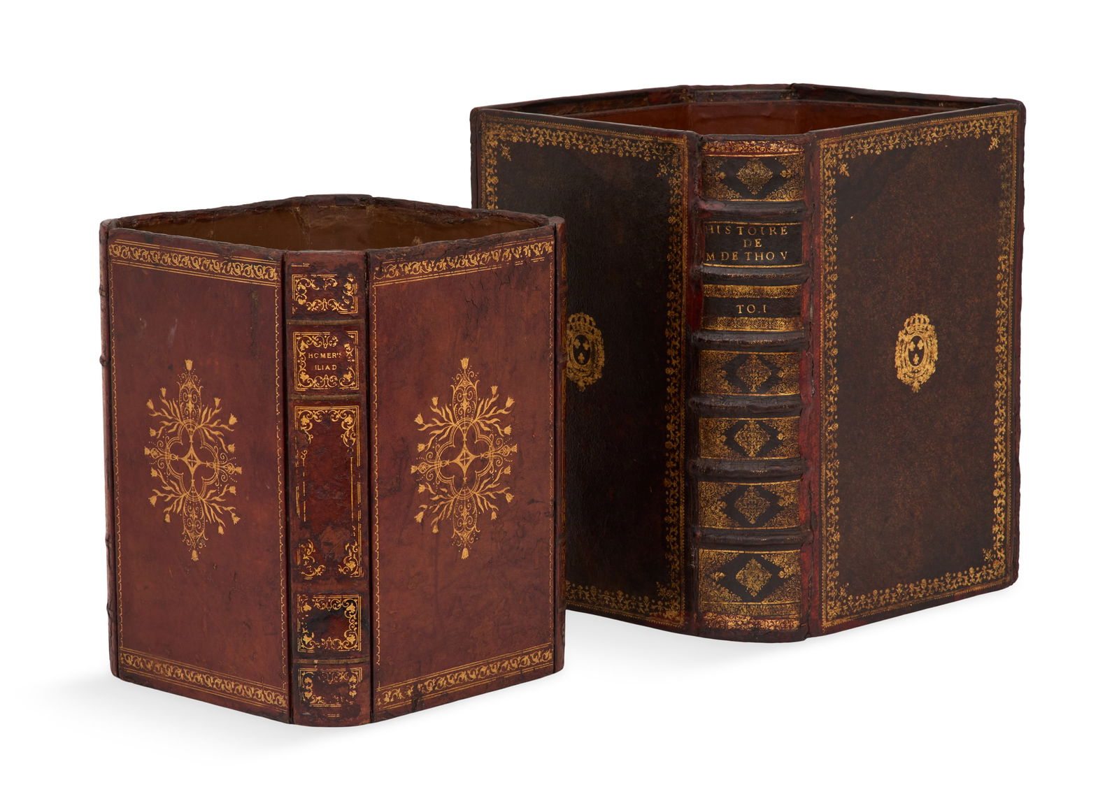 Two Gilt-Stamped Leather Waste Baskets: Two Gilt-Stamped Leather Waste Basketsthe sides composed of 18th/19th-century book bindings.h. 12-1/2", w. 9-1/2", d. 9-1/4" and h. 14-3/4", w. 11-3/4", d. 11-3/4"