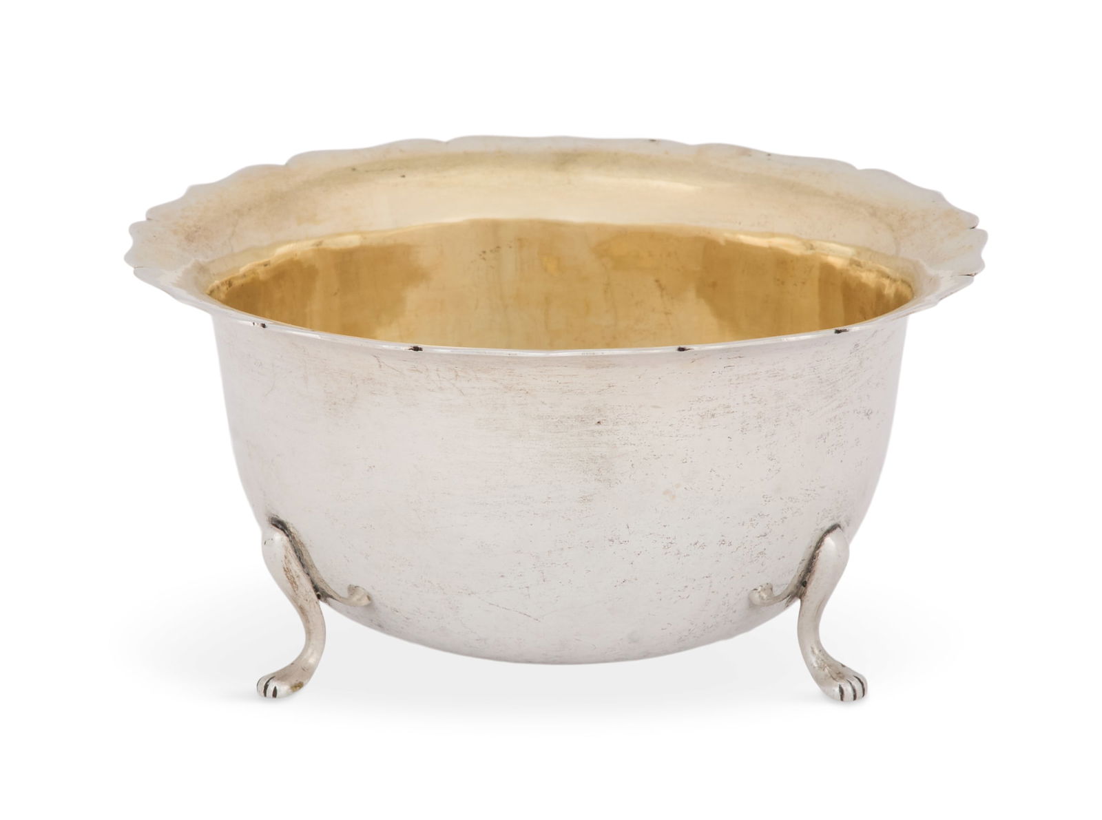 Chinese Silver Bowl: Chinese Silver Bowlca. 1900, by Hung Chong & Co., Shanghai, the deep body with serpentine-lobed rim and gilt interior, raised on three pad feet.h. 2-1/4", dia. 4-5/8"; 4.12 t. oz. Provenance: The Esta