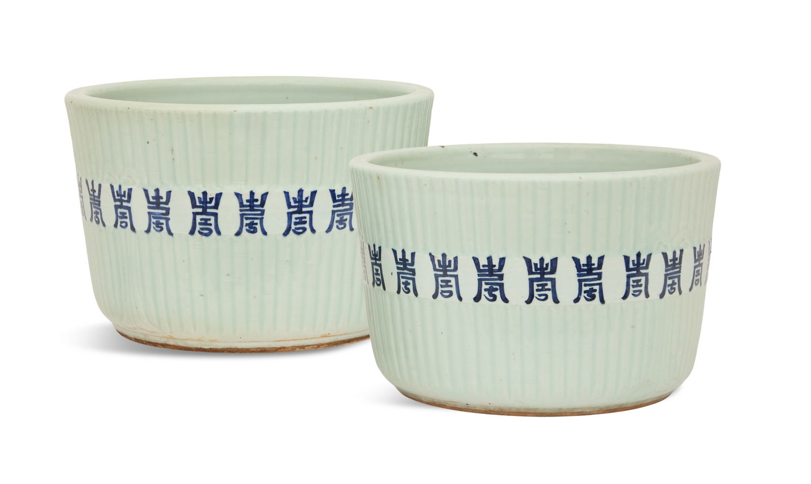 Pair of Chinese Porcelain Jardinieres: Pair of Chinese Porcelain Jardinieresin the Qianlong taste, the bamboo-decorated sides with cobalt Qianlong reign marks, with pierced drainage holes in the base.h. 9-1/2", dia. 14-1/2"