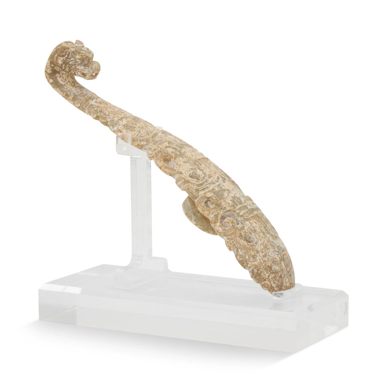 Hardstone Chinese Belt Buckle: Hardstone Chinese Belt Bucklein the Han Dynasty Style, with a dragon-carved end and edges with pierced scrollwork, a foo dog "masque" opposite the dragon, on a contemporary acrylic stand.h. 7-1/2", w.