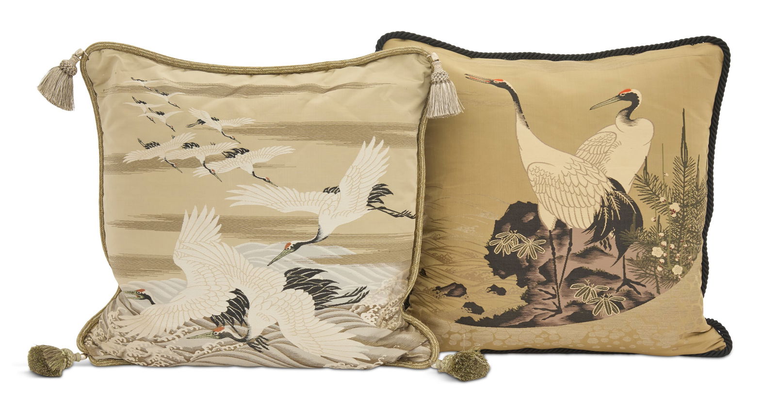 Two Japanese Silk Pillows: Two Japanese Silk Pillowsone decorated with cranes in a landscape and the other with cranes flying over the ocean, with braided trim.w. 22", d. 22" and w. 23", d. 25"