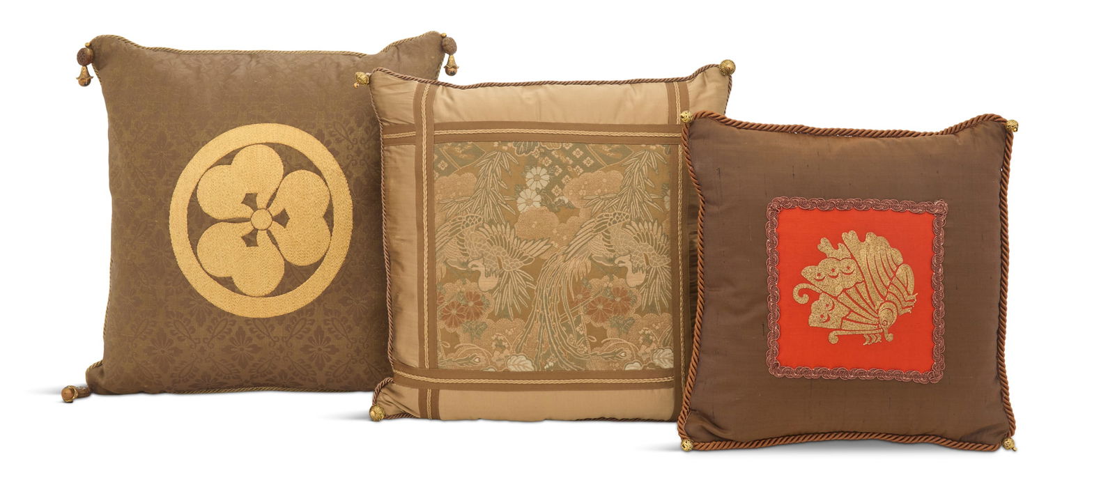 Collection of Three Japanese Silk Pillows: Collection of Three Japanese Silk Pillowsthe two largest pillows from the CMC Collection, one with a gilt family crest and the other with cranes and foliate decoration, the smaller pillow with a gilt
