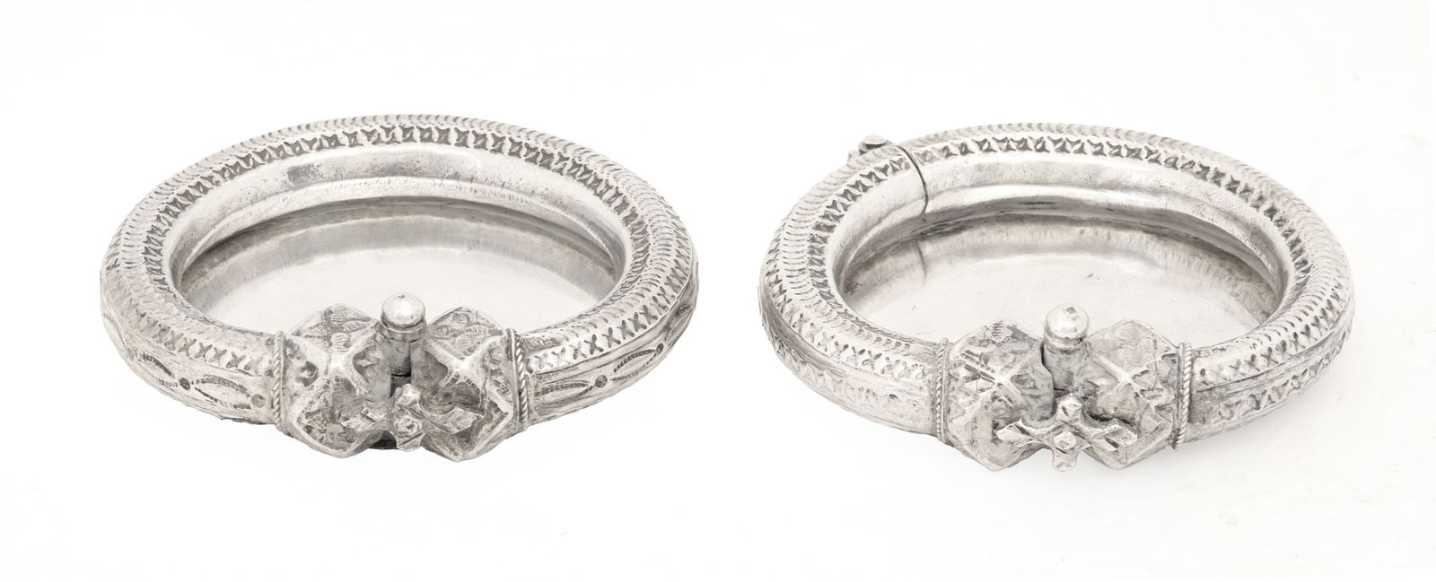 Near Pair of Bedouin Silver Bangle Trinkets Trays: Near Pair of Bedouin Silver Bangles Converted to Trinkets Traysthe conversions marked Cairo, 1965-1967, .800 silver.w. 3-3/4"; 6.78 total t. oz. Provenance: The Estate of Stella R. Sharp, Natchez, Mis