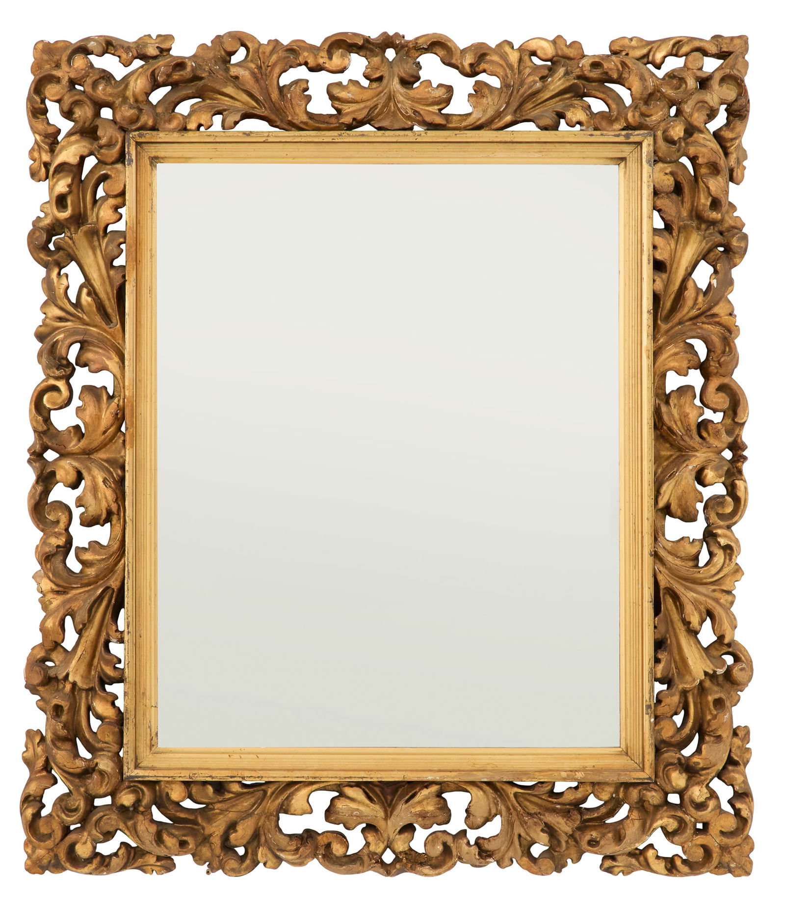 Italian Giltwood Mirror in the Baroque Taste: Italian Giltwood Mirror in the Baroque Tastelate 19th century, the bold pierced surround carved with acanthus leaves and scrollwork, with a reeded liner and set with a beveled mirror plate.h. 33-3/4",