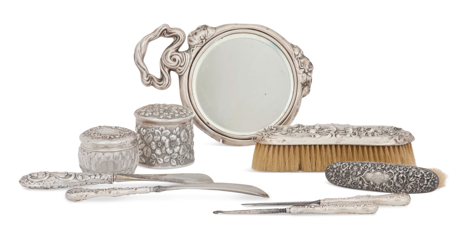 Nine Silver/Silverplate-Mounted Dresser Articles: Nine Sterling Silver and Silverplate-Mounted Dresser Articleslate 19th/early 20th century, all decorated with embossed floral rococo and Art Nouveau decoration, with sterling silver-mounted pieces:a t