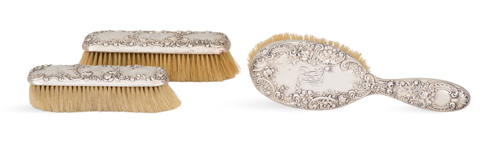 Gorham Sterling Silver-Mounted Brush Set: Three-Piece Gorham Sterling Silver-Mounted Brush Setfirst quarter 20th century, Providence, Rhode Island, including a hairbrush, l. 9-1/2", a clothes brush, l. 6-1/2", and a hat brush, l. 5-3/4", each