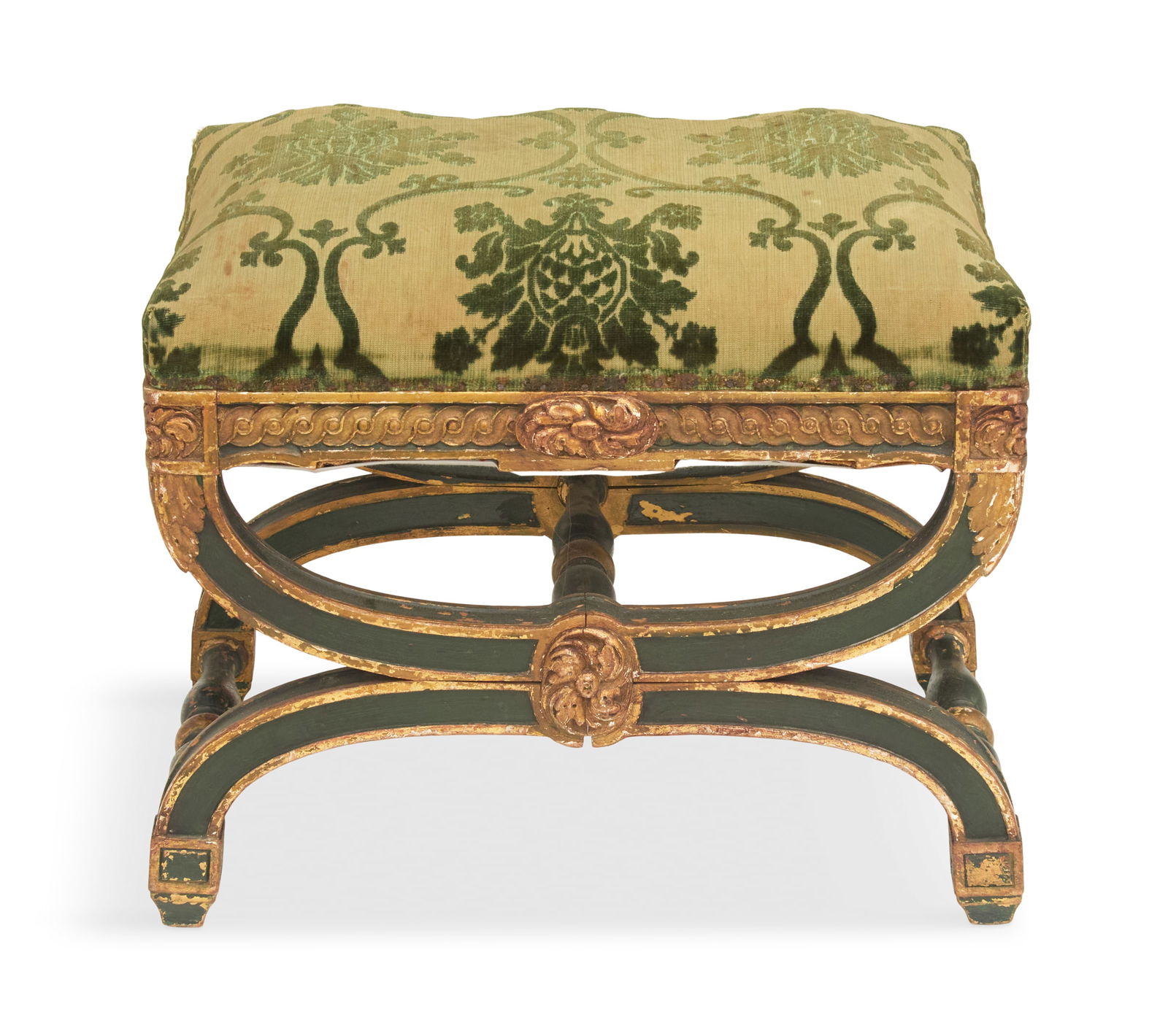 Empire Polychrome and Parcel-Gilt Footstool: Empire Polychrome and Parcel-Gilt Footstool19th century, the padded seat over a carved frame with curved X-form legs, joined by turned stretchers.h. 17-1/2", w. 22", d. 16-1/2" Provenance: Kevin Stone