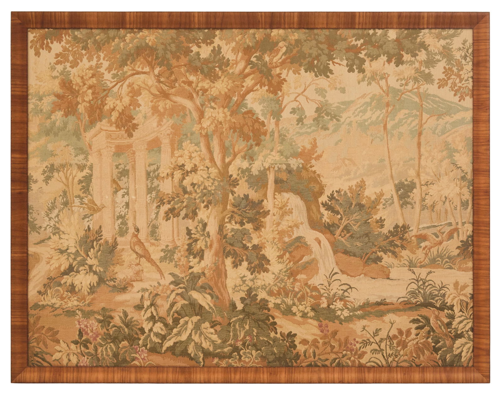 Large Framed Tapestry of 18th-Century Inspiration: Large Framed Tapestry of 18th-Century Inspirationearly 20th century, the tapestry decorated with neoclassical ruins in a garden, with a pheasant in the foreground, in a walnut-veneered ogee-molded fra