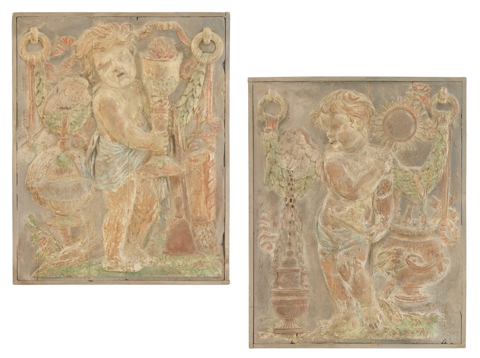 Pair of Belle Epoque Relief-Carved Wooden Plaques: Pair of Belle Epoque Relief-Carved Wooden Plaques19th century, carved with Bacchanalian cherubs drinking from wine cups, the background carved with urns, grapevines and laurel swags, accented with pol
