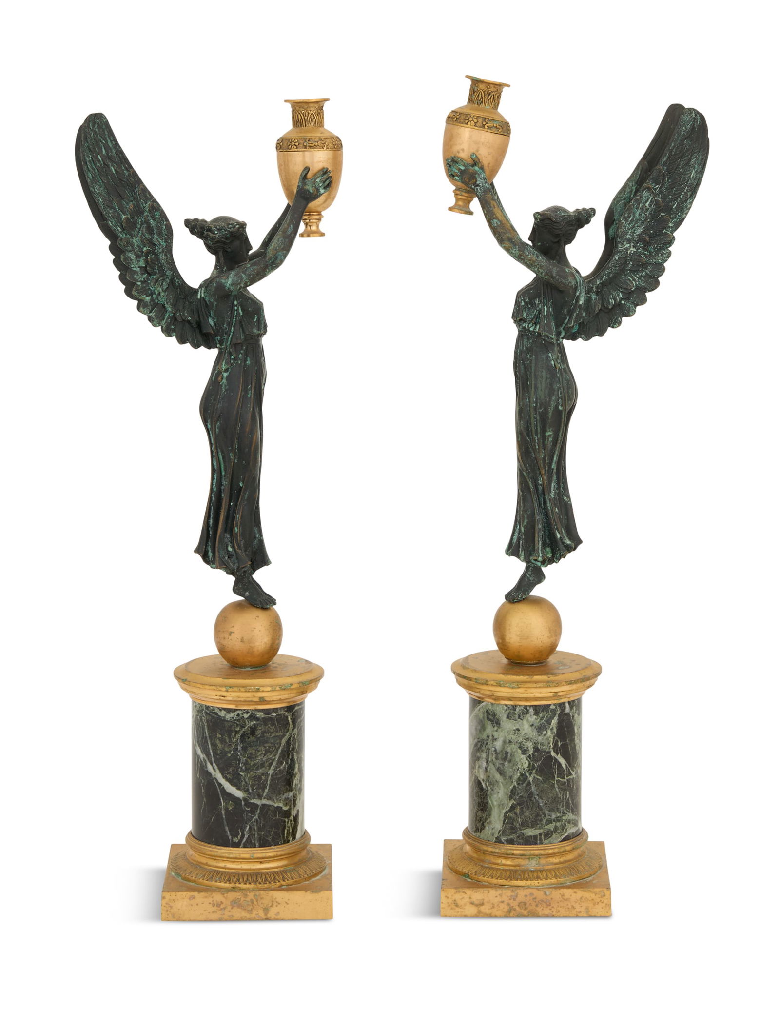 Pair of French Bronze and Marble Taper Sticks: Pair of French Bronze and Marble Taper Sticks 20th century, in the Empire taste, the patinated figures of "Victory" holding aloft bronze dore urn-form taper holders, on column-form verte antique