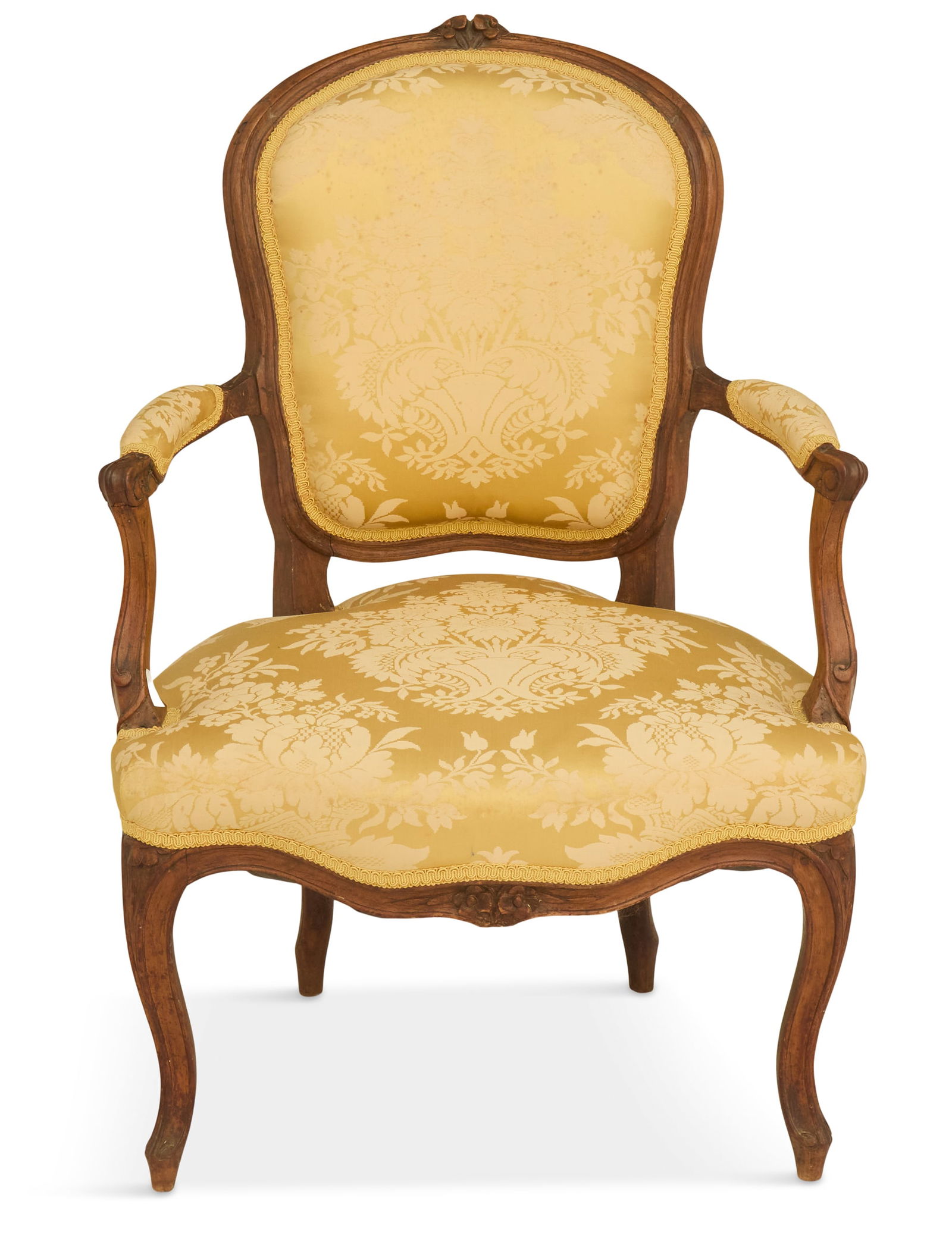 Louis XV-Style Fruitwood Fauteuil: Louis XV-Style Fruitwood Fauteuil 19th century, the domed and padded back surmounted by a floral crest, joined by padded arms to the like seat, raised on molded cabriole legs ending in scrolled toes,