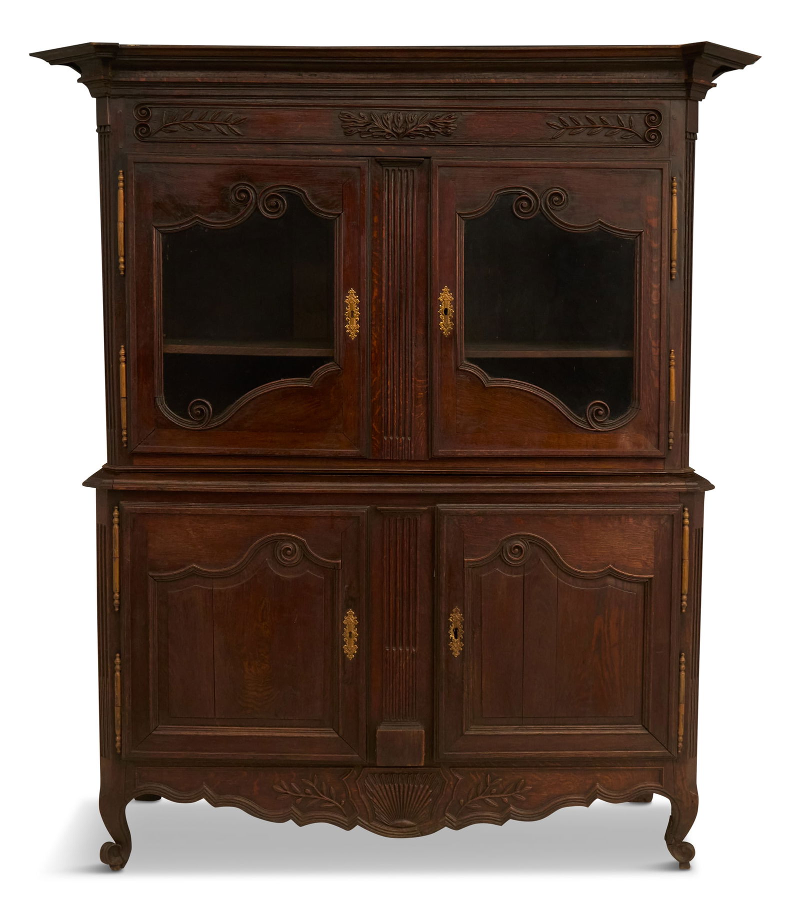 French Provincial Oak Buffet a Deux Corps: French Provincial Oak Buffet a Deux Corps 18th century, the top with a removable cornice over a scroll- and foliate-carved frieze and a pair of glazed doors, the base with a pair of framed and