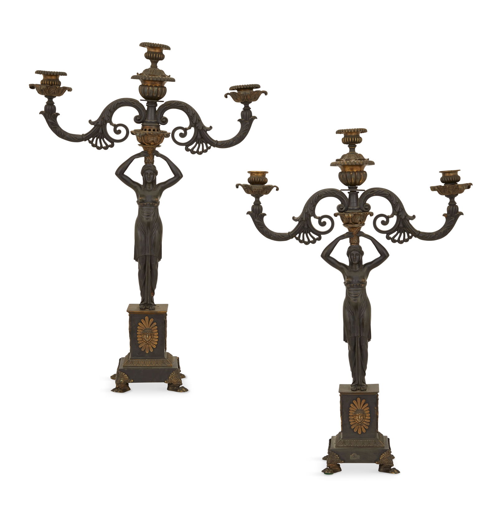 Monumental Regency Dore et Patine Candelabra: Pair of Monumental Regency Dore et Patine Figural Candelabra first quarter 19th century, the reeded candle cups supported on leaf-molded and scrolled arms, mounted on Egyptian Revival "priestesses",