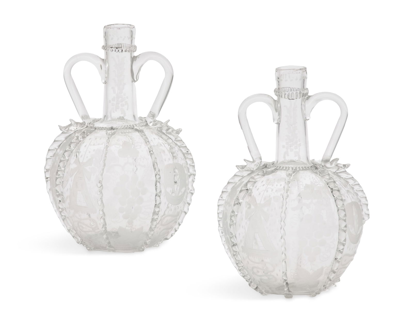 Pair of Dutch Blown- and Engraved Glass Decanters: Pair of Dutch Blown- and Engraved Glass Decanters 19th century, the globular bottles divided into panels with applied rippled glass, the panels engraved with grapes and scrollwork. h. 8-1/2", dia.