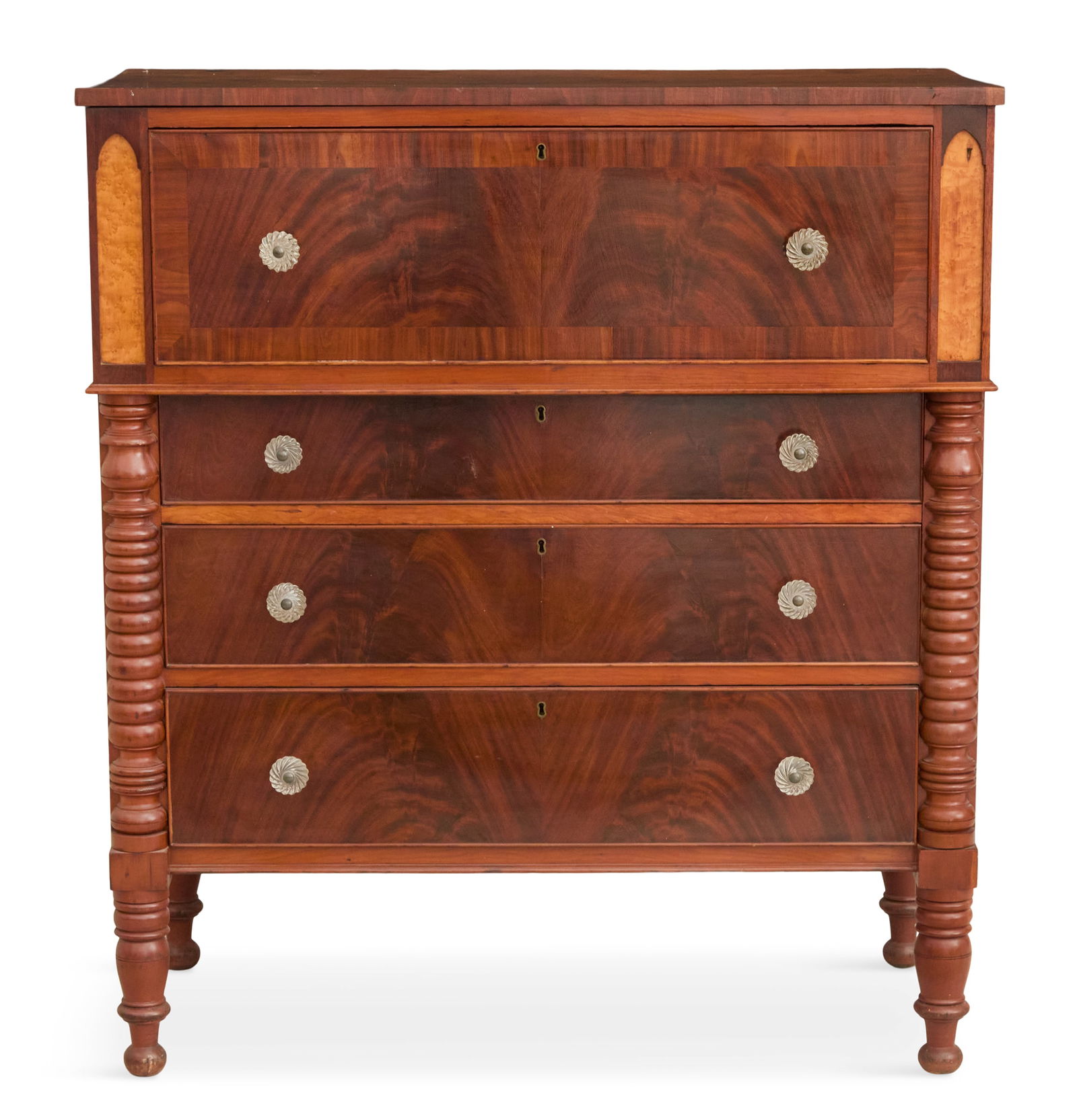 American Late Classical Chest of Drawers: American Late Classical Chest of Drawers19th century, the cherry, mahogany and bird's-eye maple chest of drawers fitted with a deep protruding blank drawer over three graduated long drawers, flanked b
