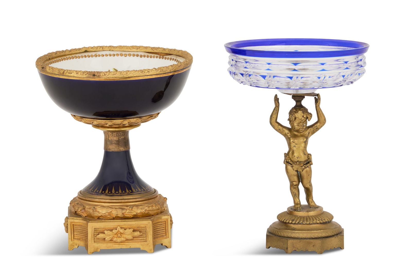 Two Continental Tazzas: Two Continental Tazzas fourth quarter 19th century, including a cut-glass and bronze example with a cobalt-cut-to-clear bowl, mounted on a bronze putti standard, h. 8-3/4", dia. 6", and a porcelain