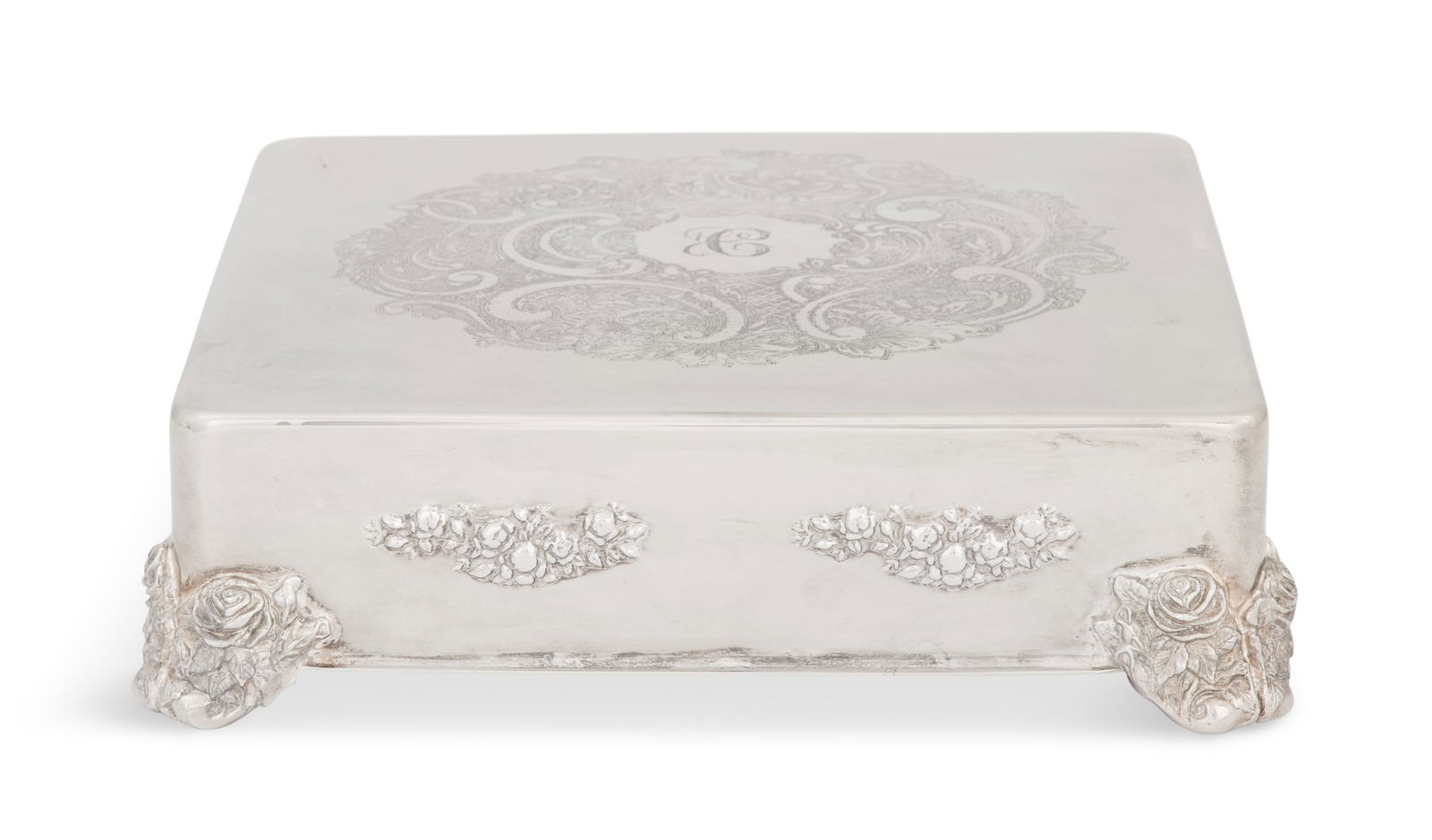 Large Silverplate Cake Stand: Large Silverplate Cake Stand20th century, square with rounded corners, the plateau etched with a large rocaille cartouche centering a monogram "C", the sides embossed with floral swags, and raised on