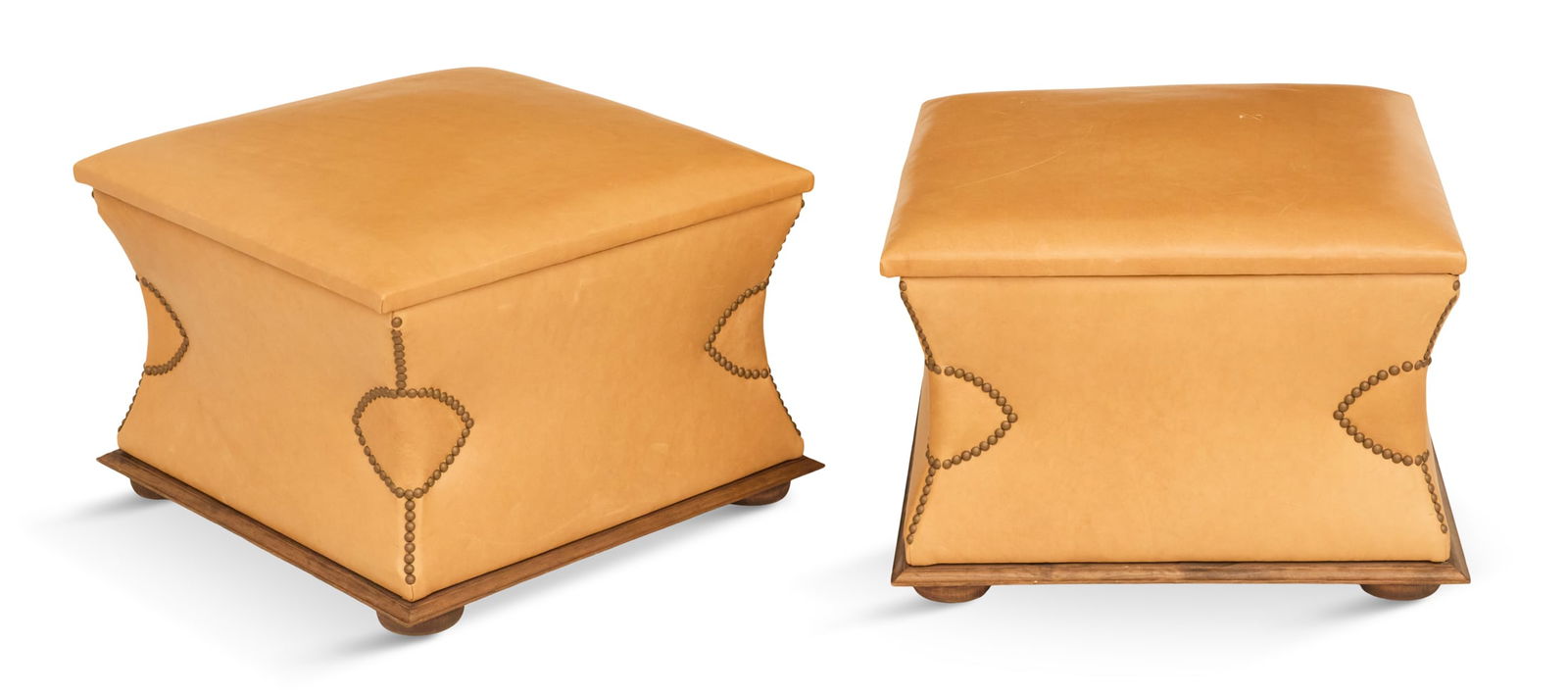 Pair of Contemporary Leather Ottomans: Pair of Contemporary Leather Ottomans each with a padded seat opening to a storage interior, incurved sides, trimmed with brass tacking and raised on bun feet. h. 17", w. 24", d. 24"