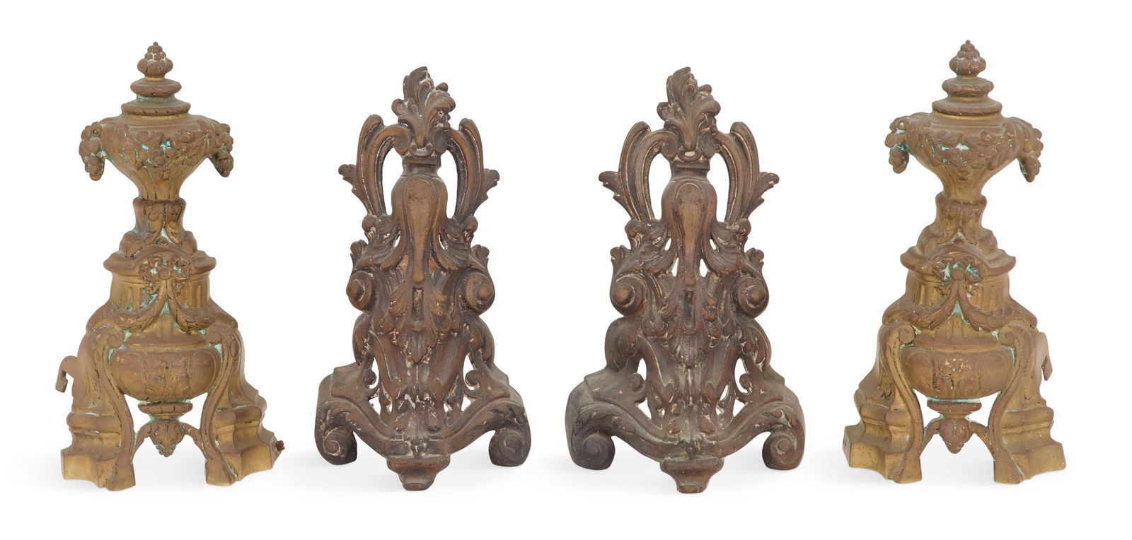 Two Pairs of French Bronze Chenets: Two Pairs of French Bronze Chenetslate 19th century, one pair of Louis XIV inspiration, with urn-form finials, and the other pair in the rococo taste, molded with pierced scrollwork.h. 9-1/2" to 10-1/