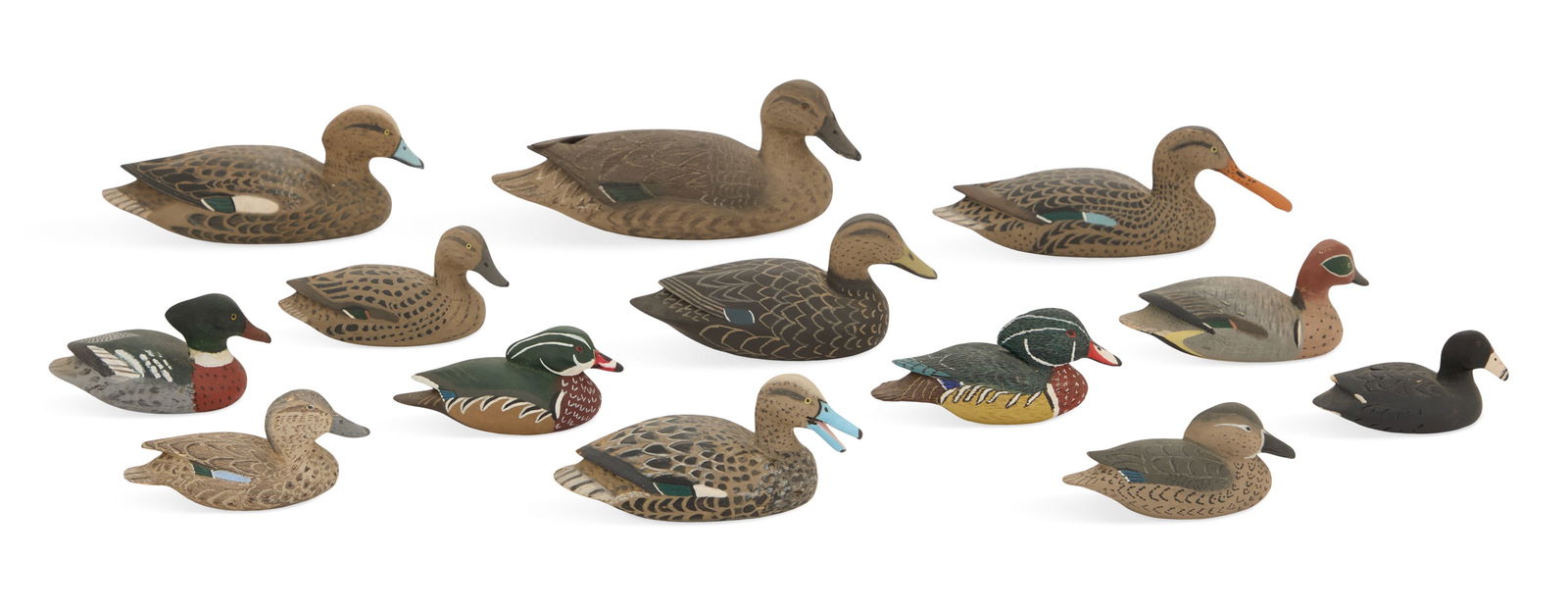 Laurent Verdin, Jr. (USA/Louisiana, 1913-2019): Laurent Verdin, Jr.(American/Pointe-au-Chien, LA, 1913-2019)"Thirteen Miniature Duck and Coot Decoys"carved and painted woodeach signed en verso.ranging from 8-1/2" x 3-1/2" to 3-1/2" x 2" Provenance:
