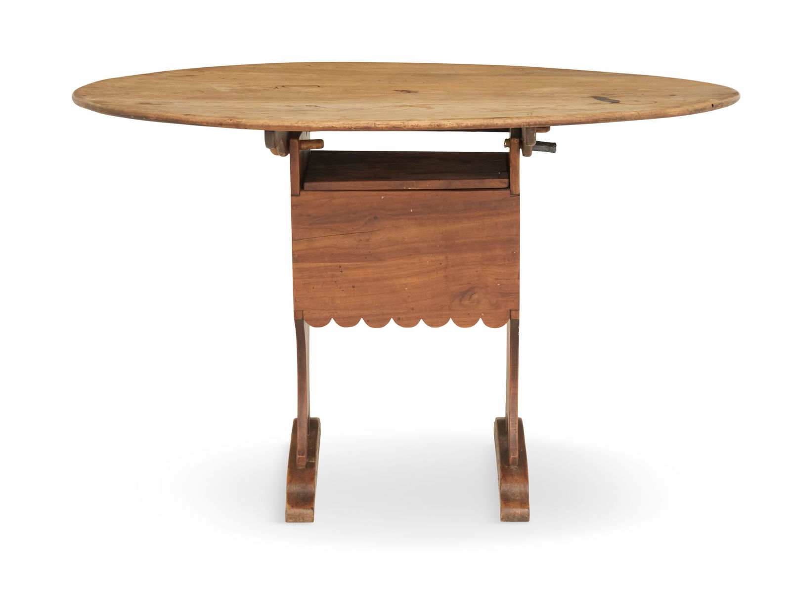 New England Chair Table: New England Chair Tablelate 18th century, walnut, the oval top attaches to the base with pins, and when down the top swivels up to allow for usage as a chair, the box-form trestle and base supported o