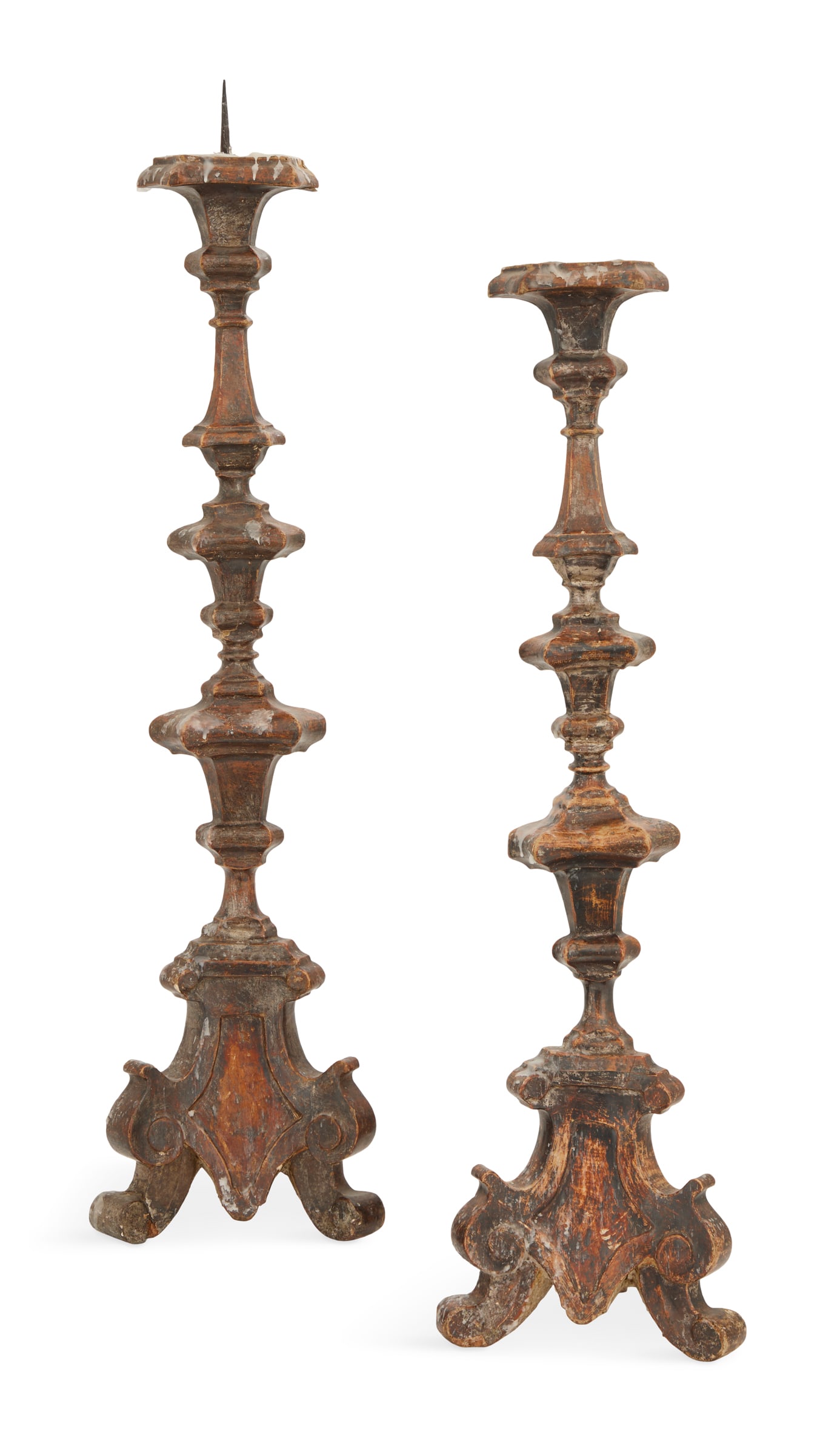 Pair of Italian Silver Giltwood Altar Sticks: Pair of Italian Silver Giltwood Altar Sticks18th century, the tripartite stands composed of tapered ogee-carved stacked elements, on bases raised on scrolled feet.h. 33-1/4", dia. 7" Provenance: The C