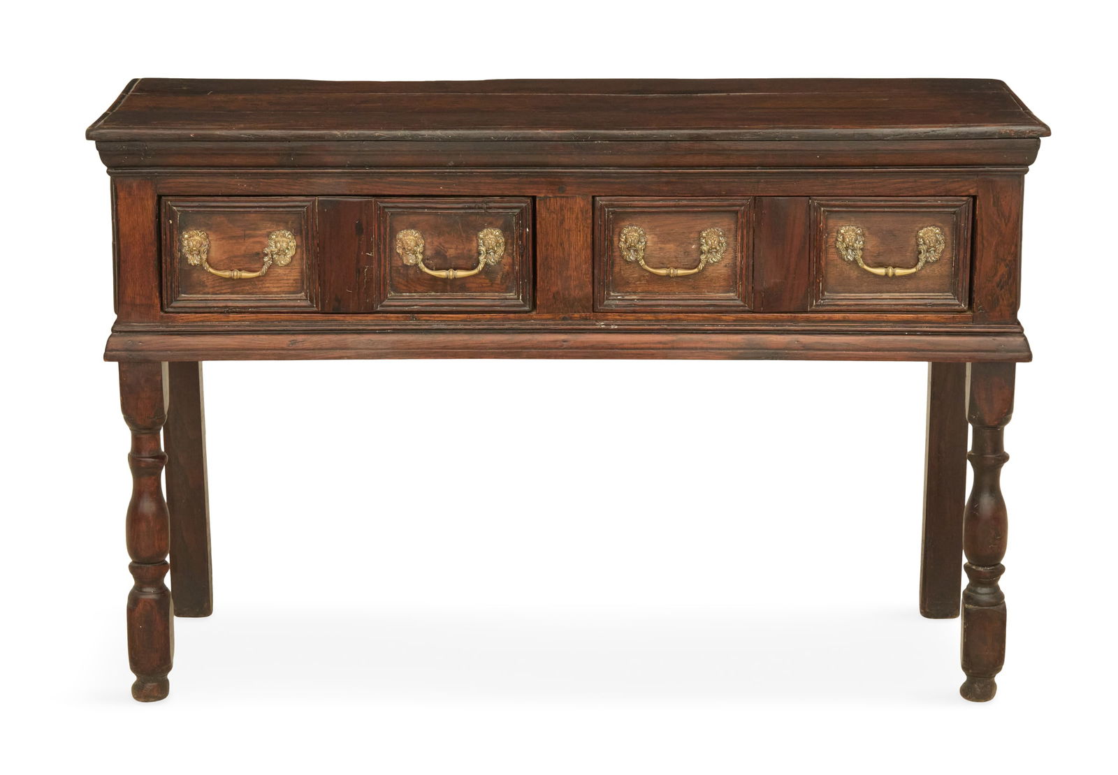 Jacobean Oak Side Table: Jacobean Oak Side Table18th century, the rectangular molded top above a pair of framed and paneled drawers, dressed with brass bail handles with lion masques, raised on block-and-turned legs.h. 30-1/2