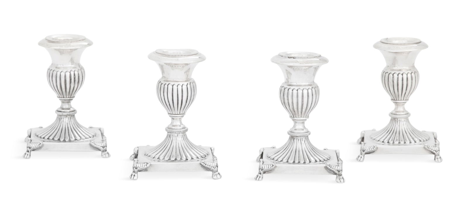 Set of Four Italian Sterling Silver Candlestands: Set of Four Italian Sterling Silver Candlestandsthird quarter 20th century, Palermo, each with a gadrooned vasiform nozzle above a pedestal foot en suite and square plinth, with a beaded candlesocket