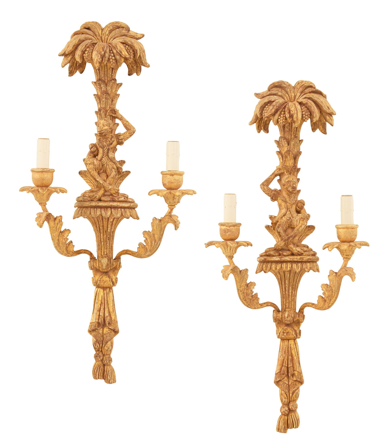 Pair of Italian Carved Giltwood Sconces: Pair of Italian Carved Giltwood Sconces20th century, fancifully carved with monkeys under palm trees, sitting atop the fan-carved backplates, set with pairs of leaf-carved candle arms terminating in t
