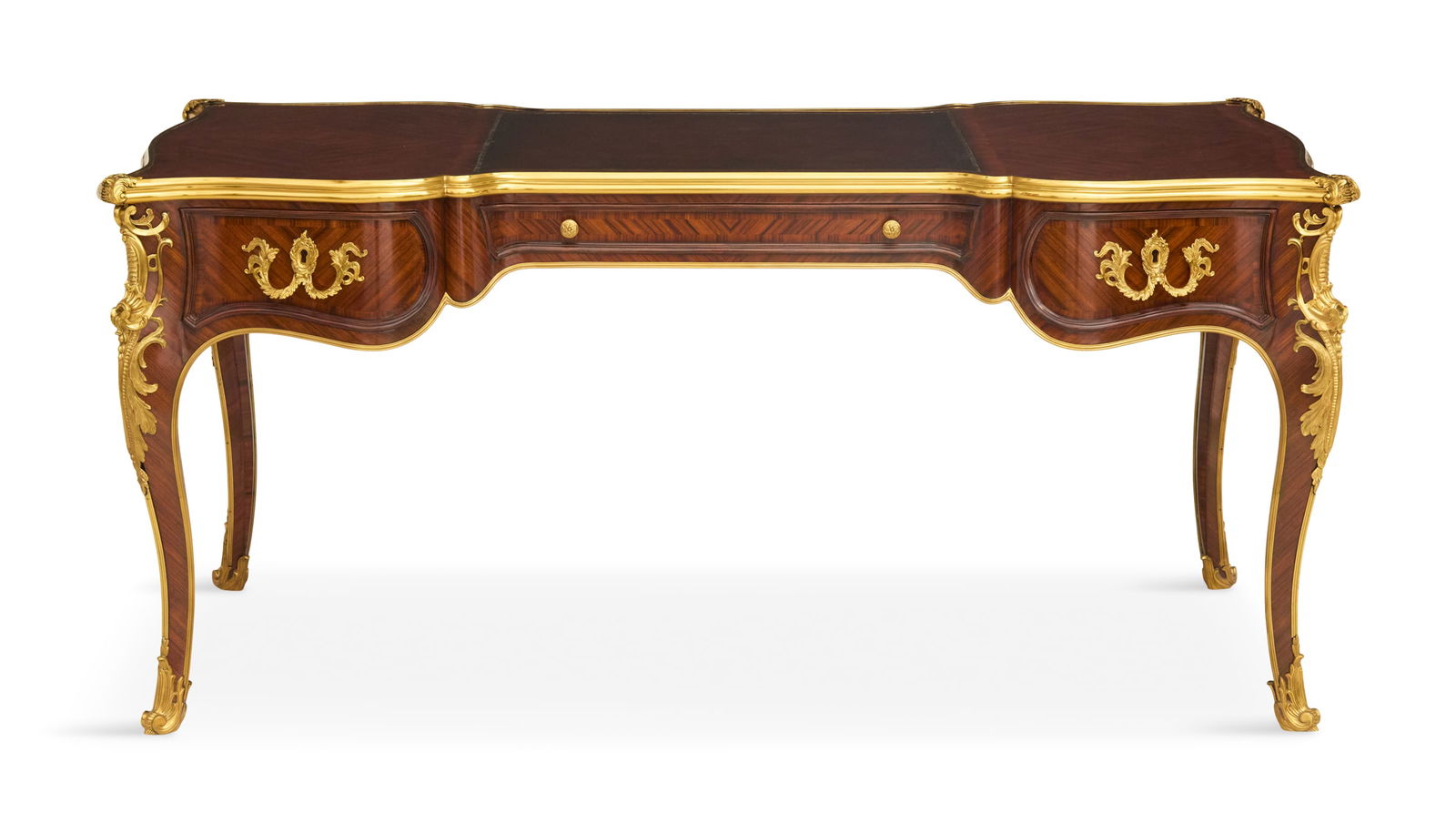 Theodore Alexander Kingwood Bureau Plat: Theodore Alexander Kingwood Bureau Plat the ormolu-mounted bureau having a top with a central inset leather blotter, the front fitted with three drawers, raised on cabriole legs. h. 30-1/2", w. 65",