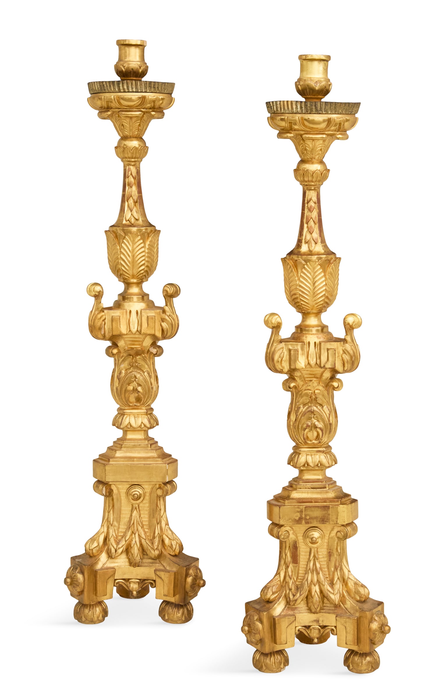 Pair of Monumental French Giltwood Altar Sticks: Pair of Monumental French Giltwood Altar Sticks early 19th century, the turned leaf-carved candle sockets mounted on fluted tole drip pans, supported on vasiform standards carved with acanthus leaves