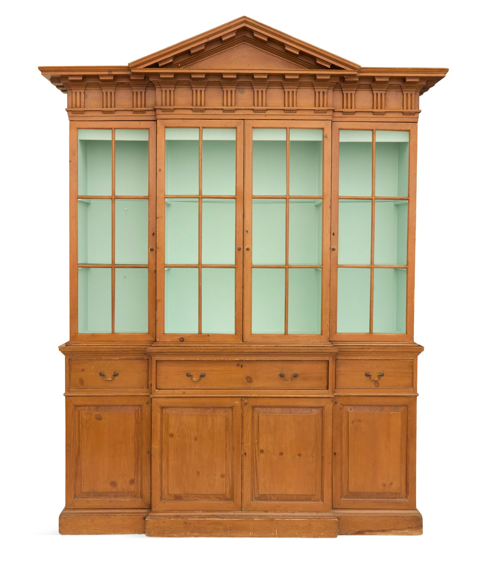 English Scrubbed Pine Breakfront Secretary: English Scrubbed Pine Breakfront Secretaryearly 20th century, in the George III taste, the peaked pediment above a bold dentillated frieze, the upper case fitted with four glazed doors, the base with