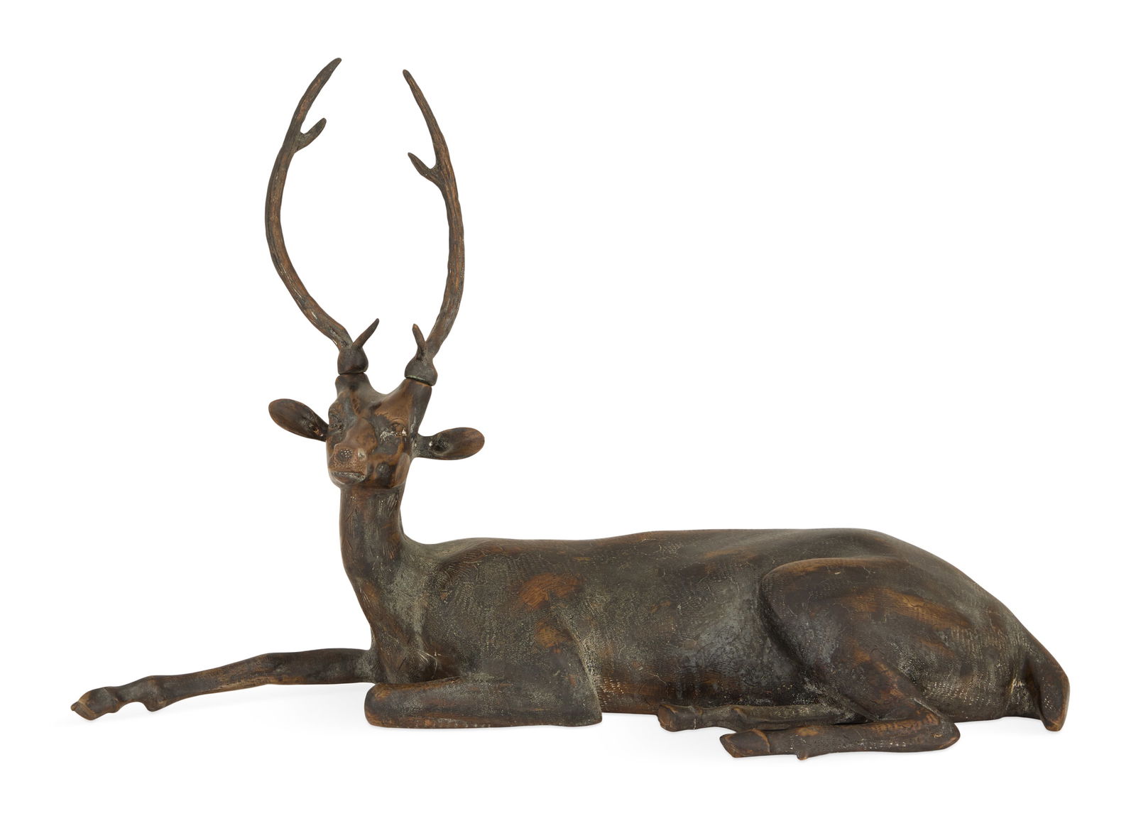 Indian Patinated Bronze Recumbent Stag: Indian Patinated Bronze Recumbent Stag 20th century, with a dark brown patina, the stag with tooled fur and spots. h. 16", w. 23", d. 8"