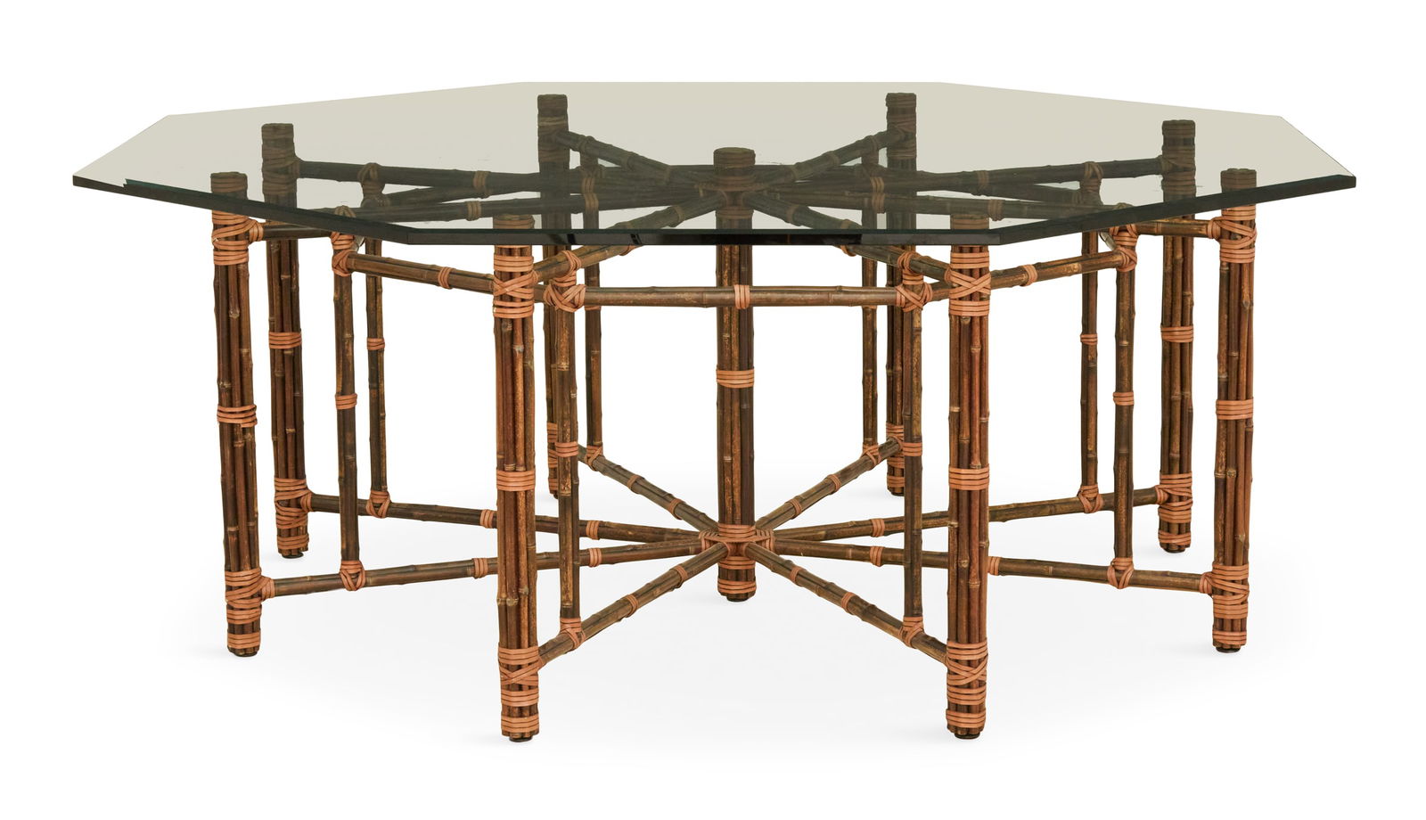 Octagonal Glass and Bamboo Table: Octagonal Glass and Bamboo Table20th century, attributed to McGuire, San Francisco, the thick plate-glass top with a beveled edge, on an eight-legged bamboo base comprised of bamboo stalks strapped to