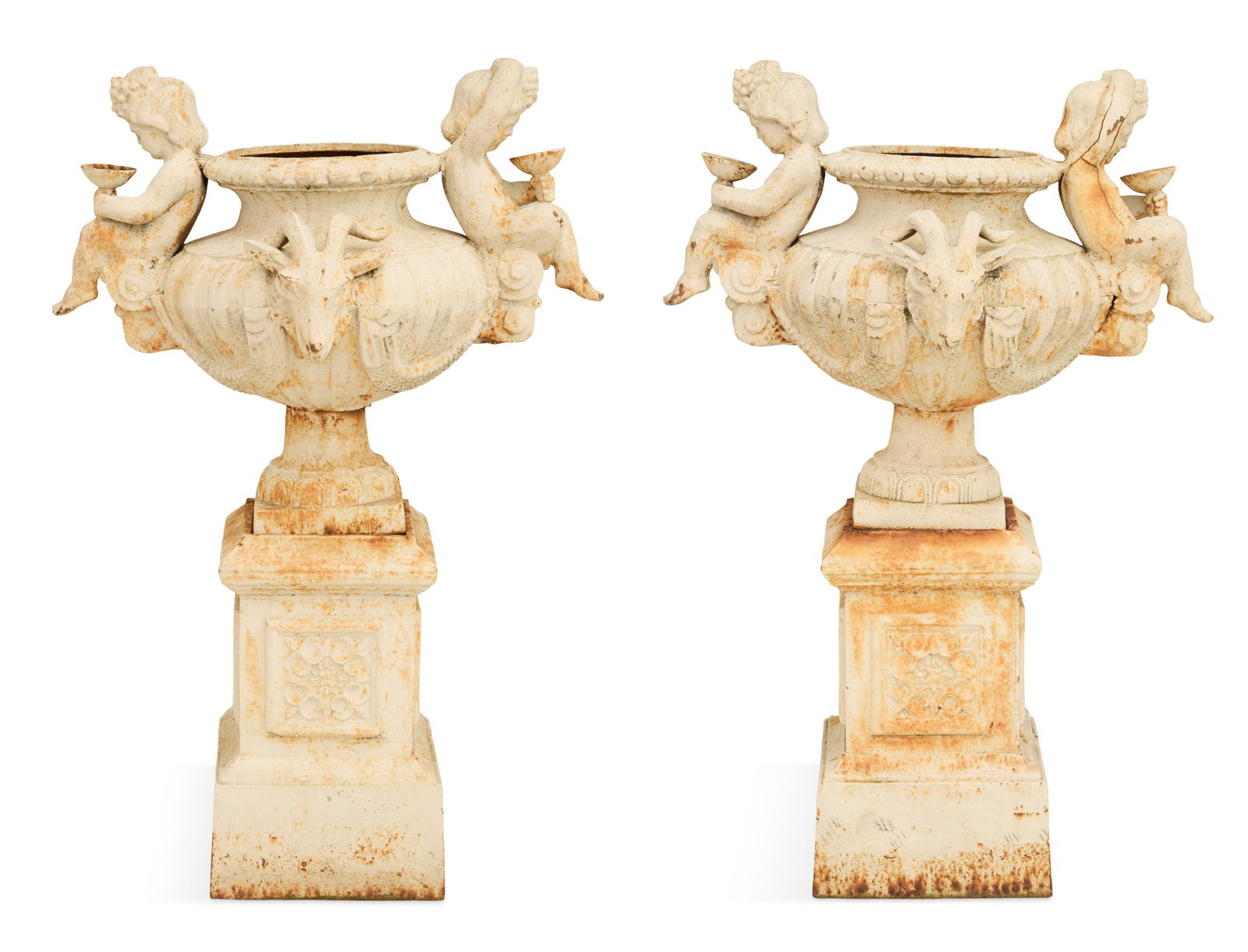 Pair of French Cast-Iron Figural Garden Urns: Pair of French Cast-Iron Figural Garden Urnslate 19th century, the reeded urns mounted on two sides with Bacchanalian putti holding kylixes, and ram's heads on the other sides, with swags of fruit in